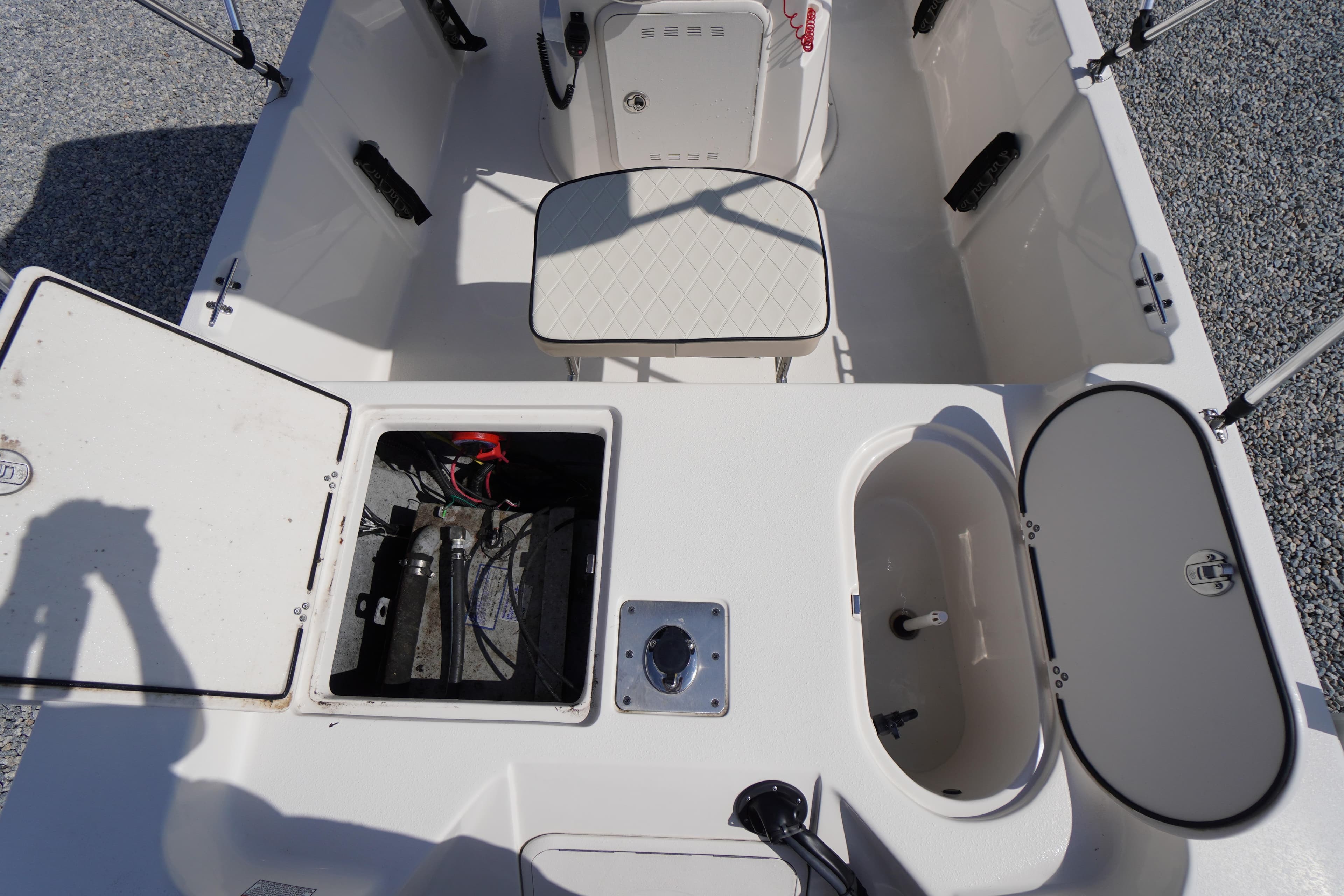2024 Carolina Skiff 182 boat interior with storage compartments and seating.