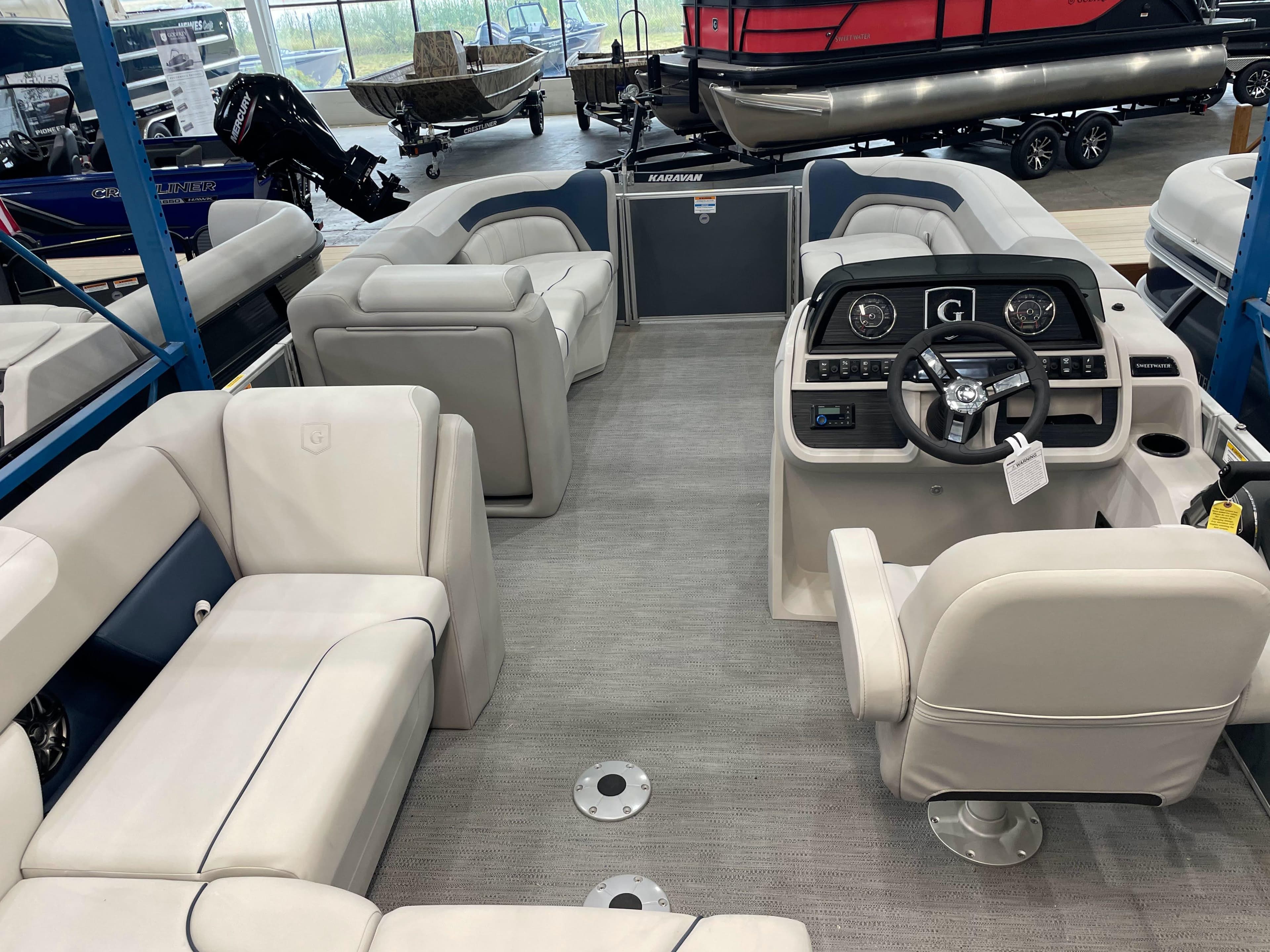 2025 Godfrey Sweetwater 2086 C pontoon boat interior with plush seating and modern dashboard.