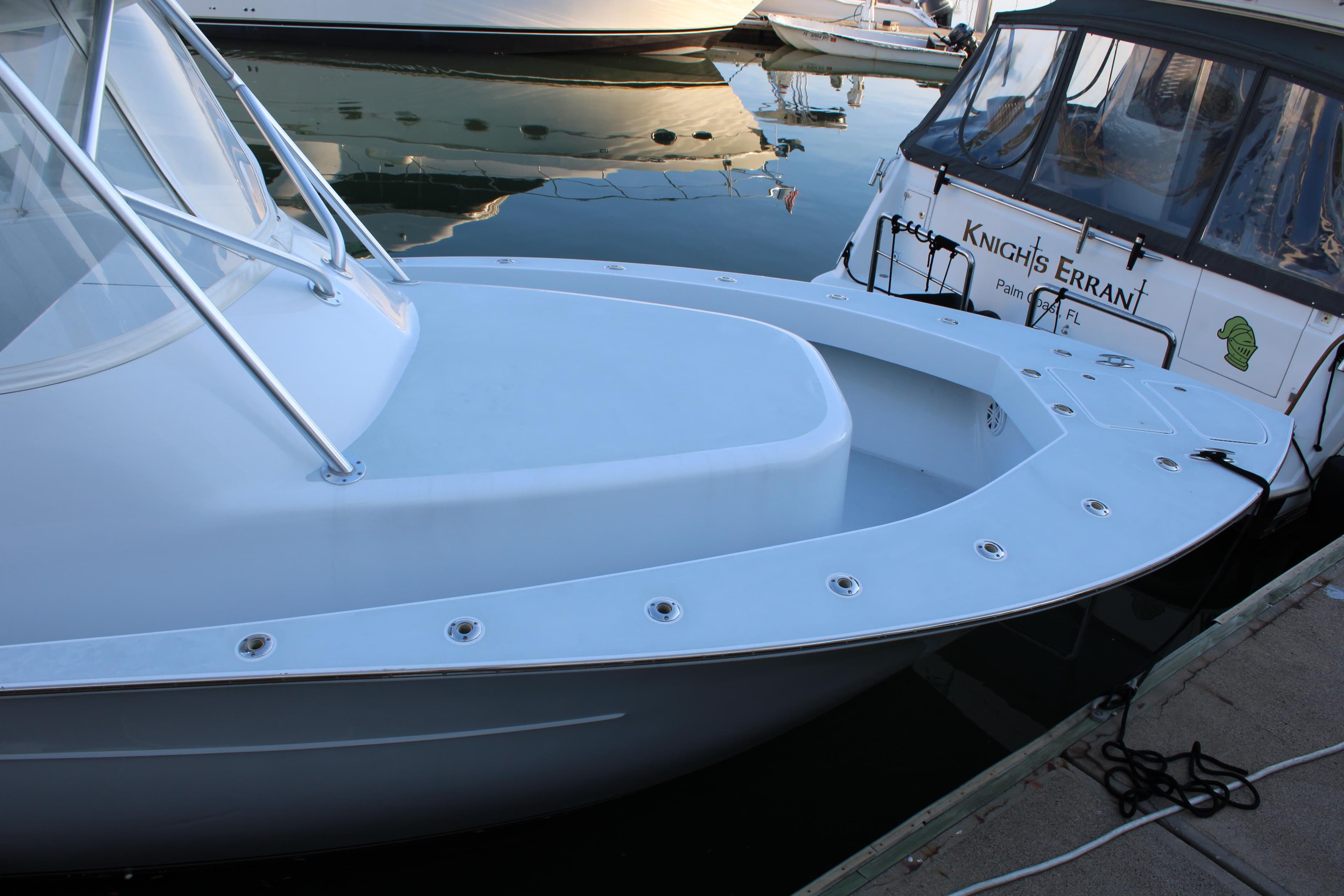 2010 Legend 37 Walkaround boat docked at marina.