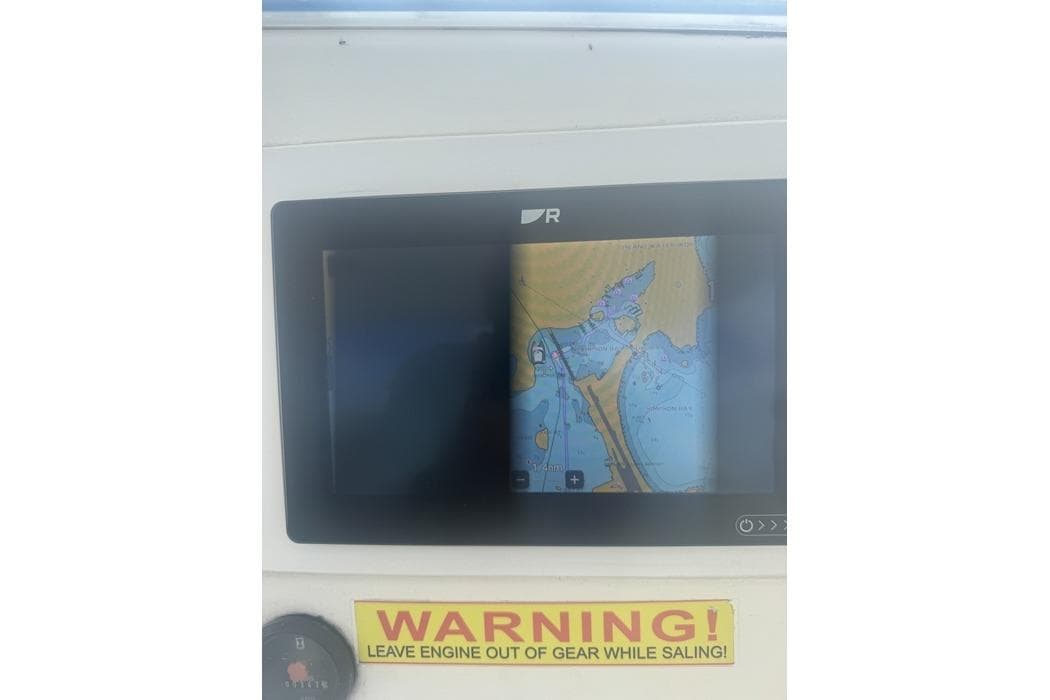 Navigation screen on Leopard 39 yacht, 2011 model, with warning label below.