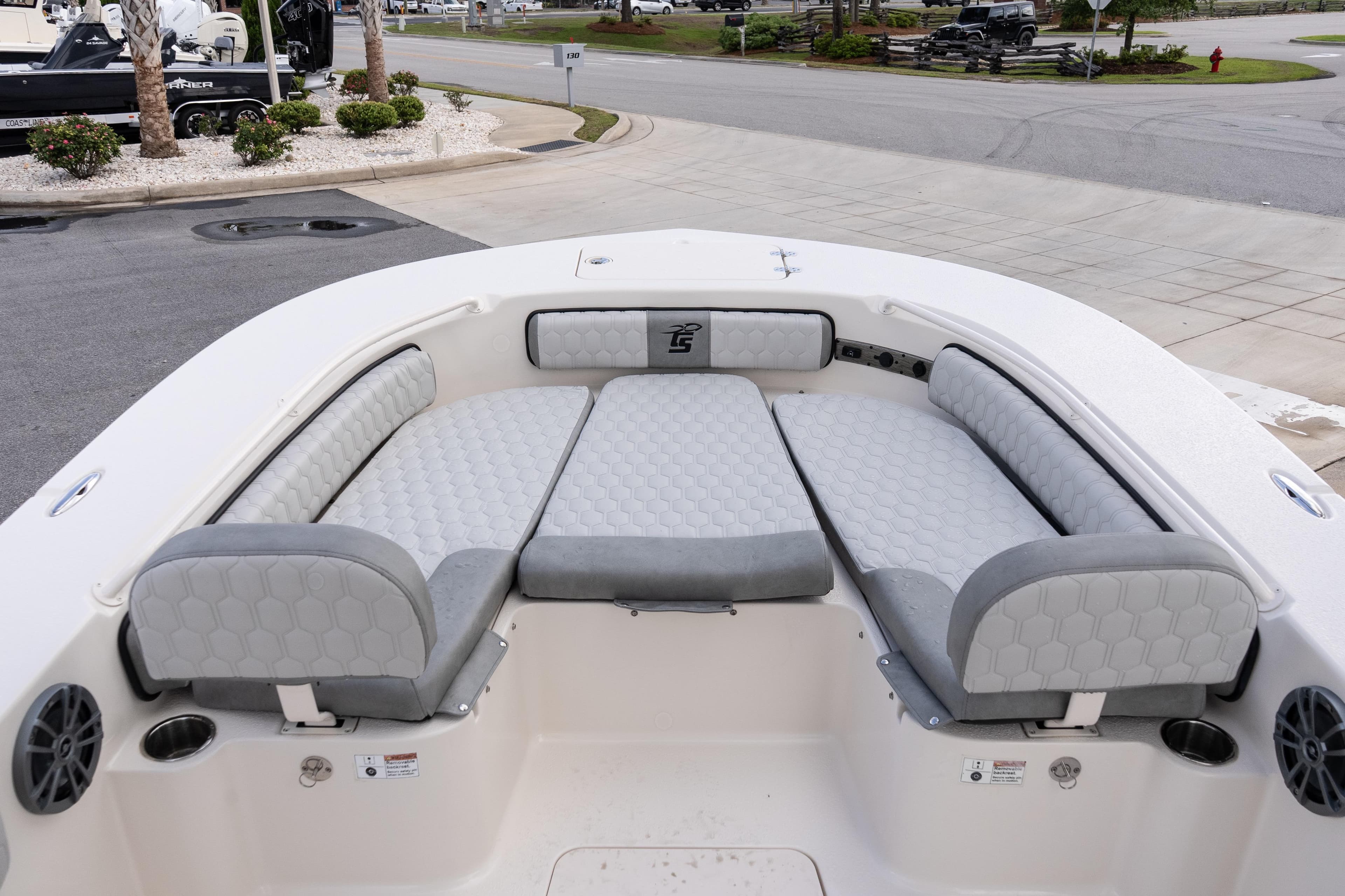 2026 Carolina Skiff 24 Ultra Elite boat interior with cushioned seating and cup holders.