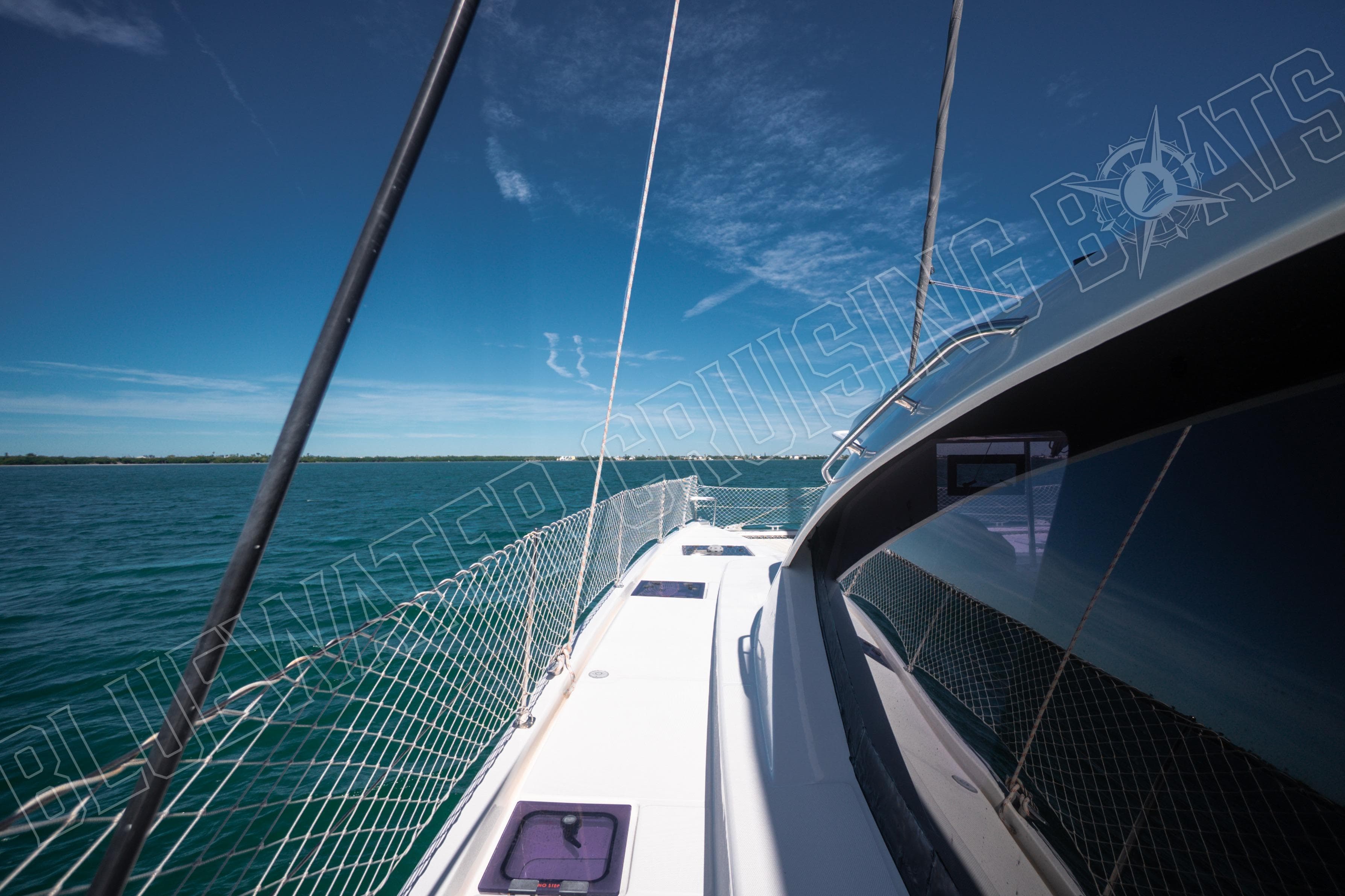 2020 Leopard 58 yacht sailing on clear blue waters under a sunny sky.