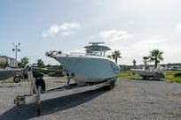 2007 Fountain 38 CC Tournament Edition boat on trailer in sunny outdoor setting.