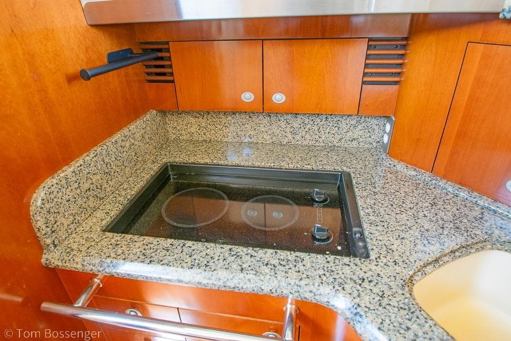 Granite countertop with built-in stove on 2005 Sea Ray 420 Sedan Bridge yacht.