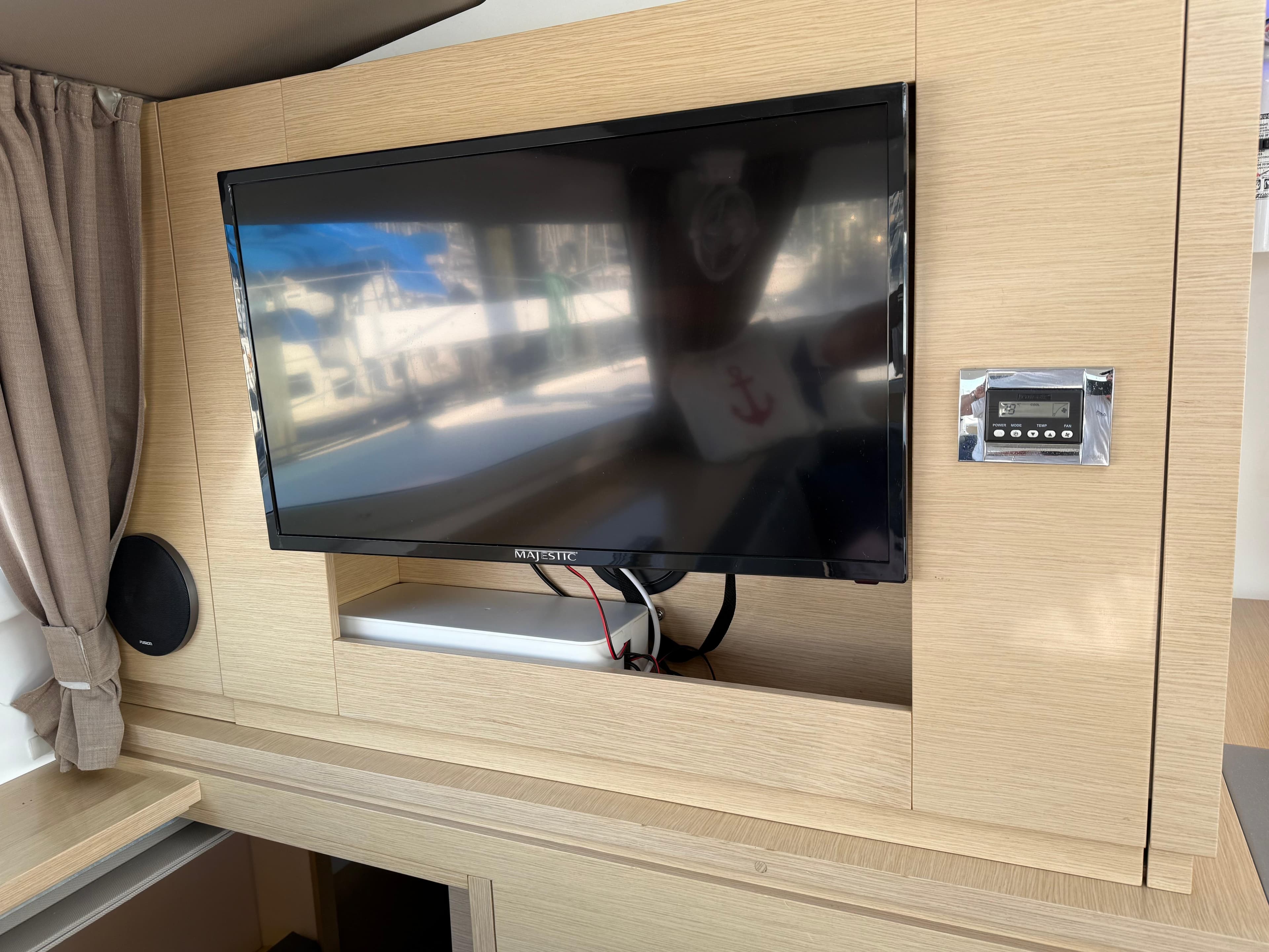 Interior of 2015 Fountaine Pajot Helia 44 with TV and control panel.