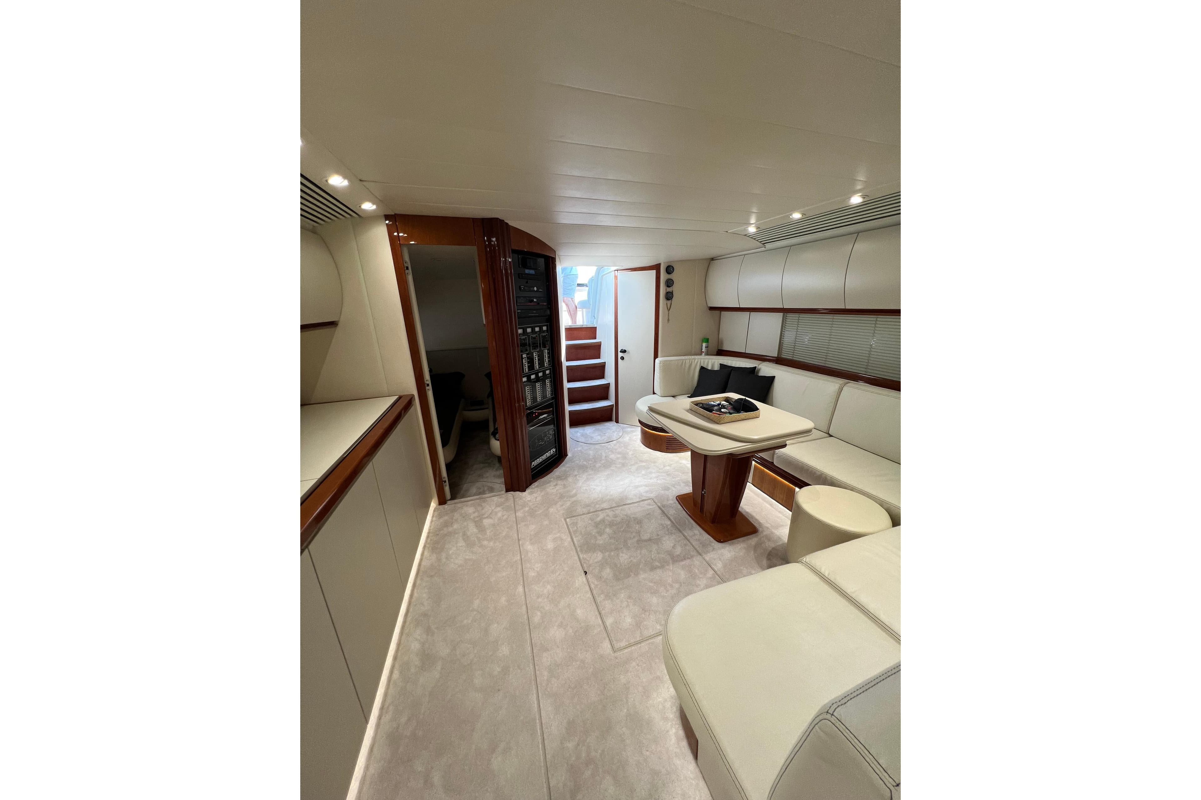 Luxurious interior of a 1995 Pershing 54 yacht with elegant seating and modern design.