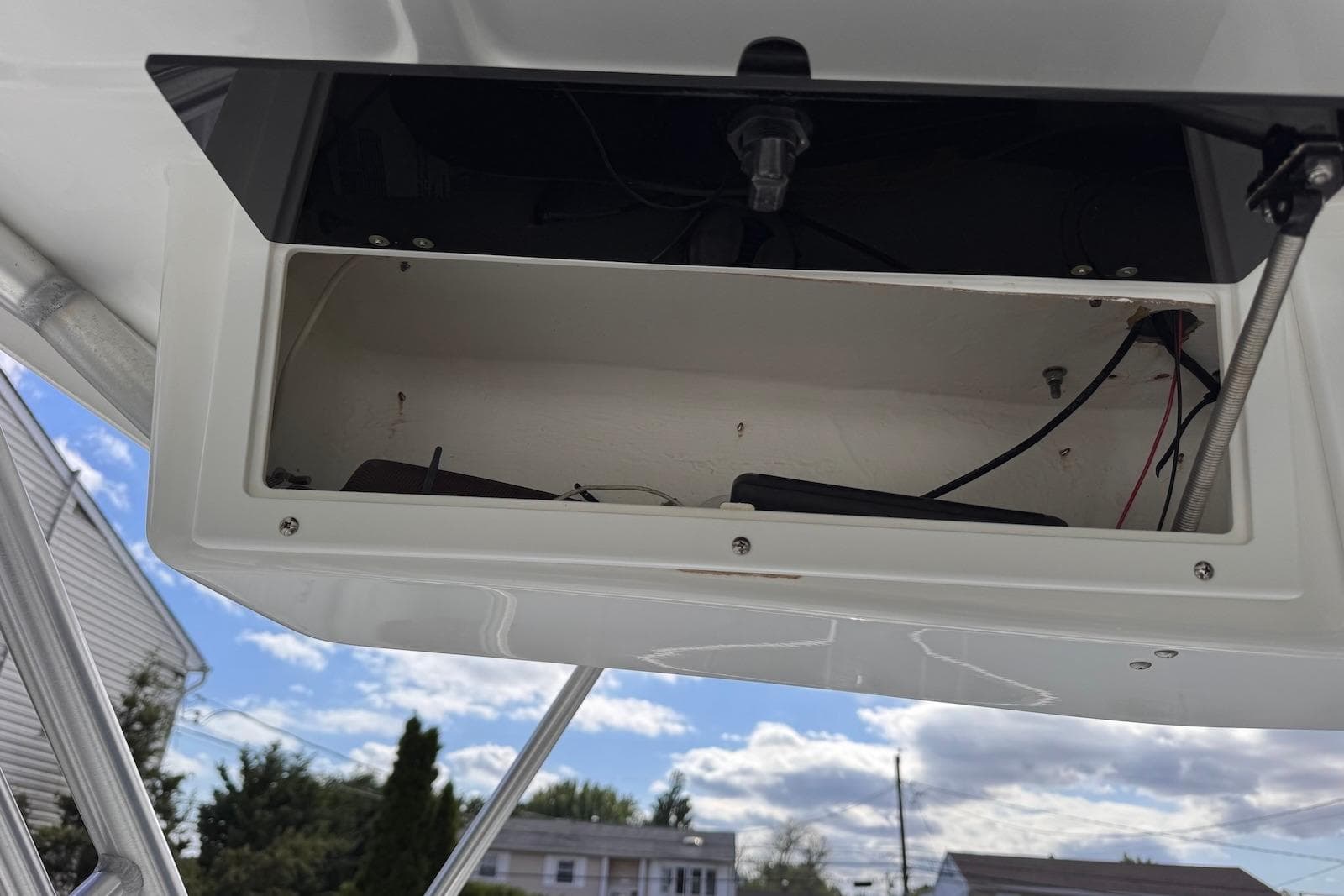 Open storage compartment on a 2006 Sea Pro 238 Walk Around boat.