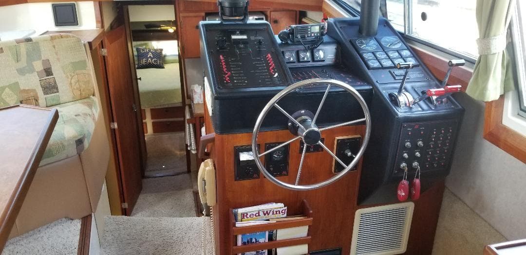 Interior of 1989 Bayliner 3888 Motoryacht, helm station and cabin.