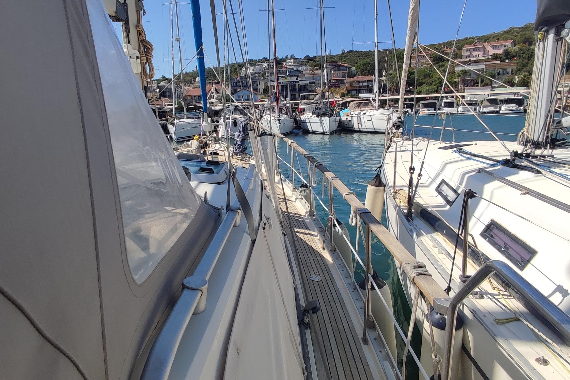 Sailboats docked in a marina, featuring a 1997 Nauticat 42.