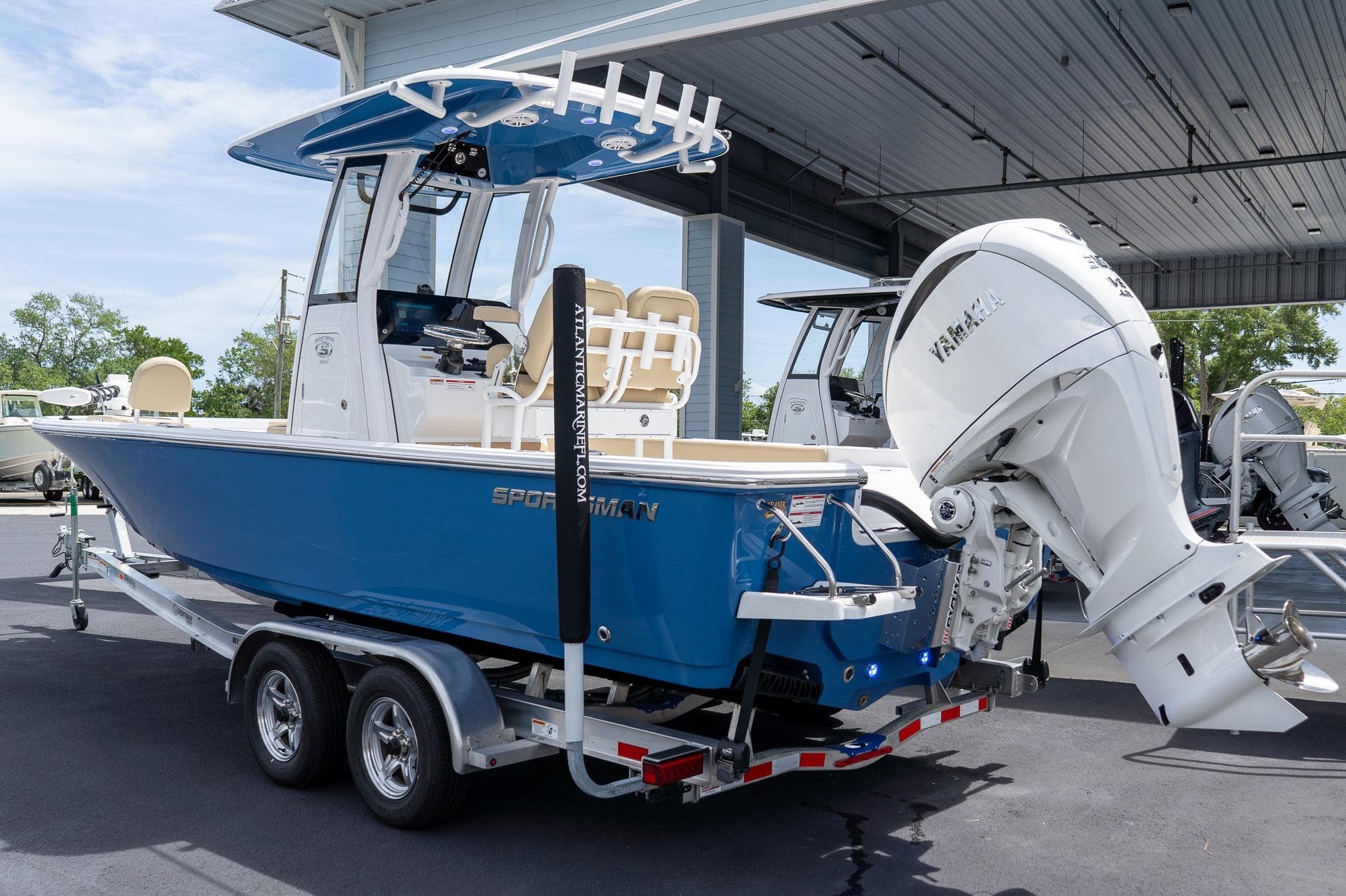 2026 Sportsman Masters 247 Bay Boat with Yamaha engine on trailer.