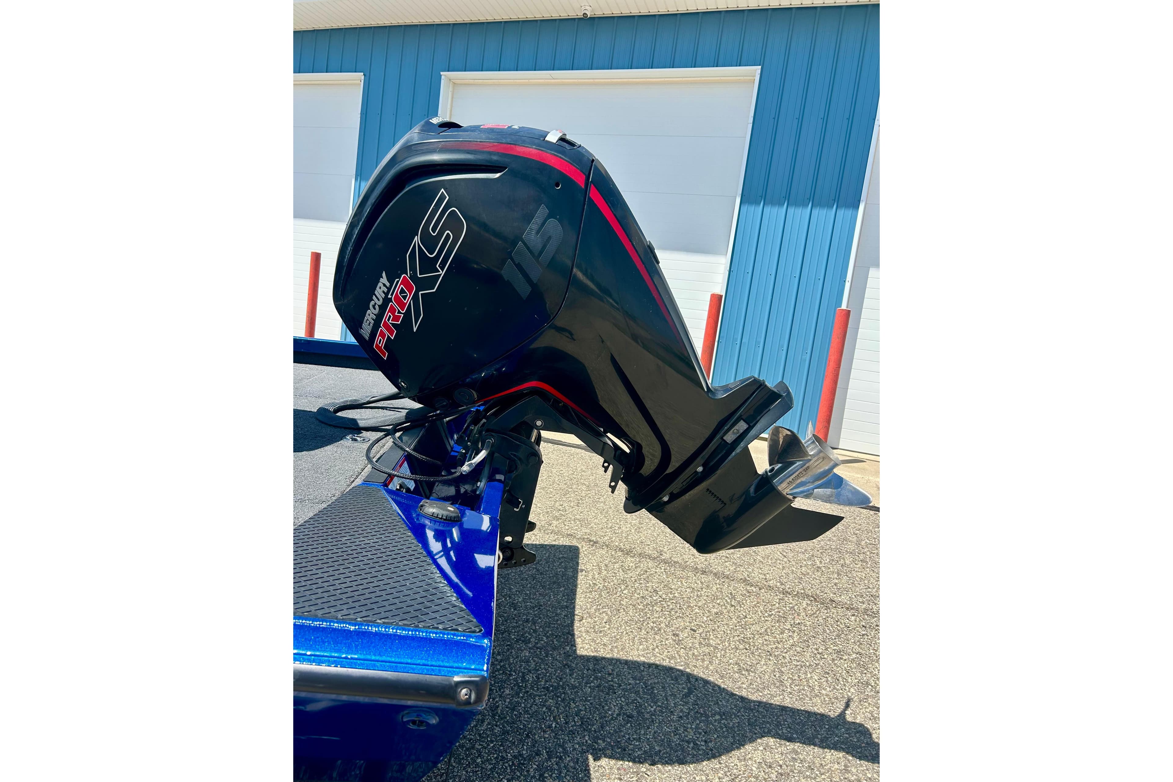 2017 Triton 18 C TX boat with Mercury Pro XS outboard motor, parked outdoors.