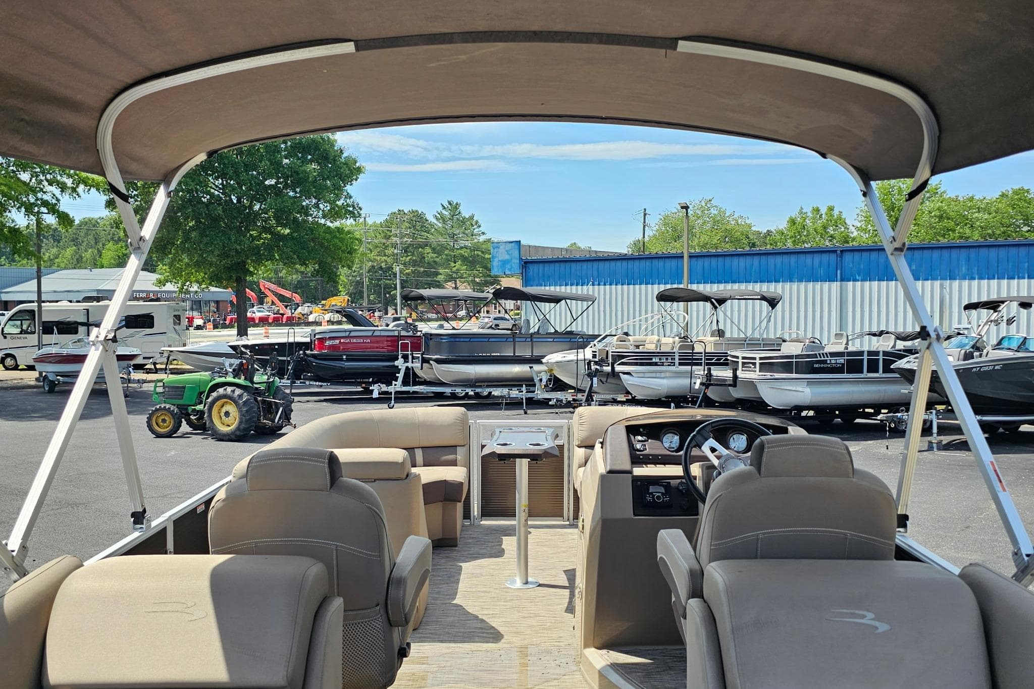 2020 Bennington SXP 22 SCWXP pontoon boat interior at a dealership lot.