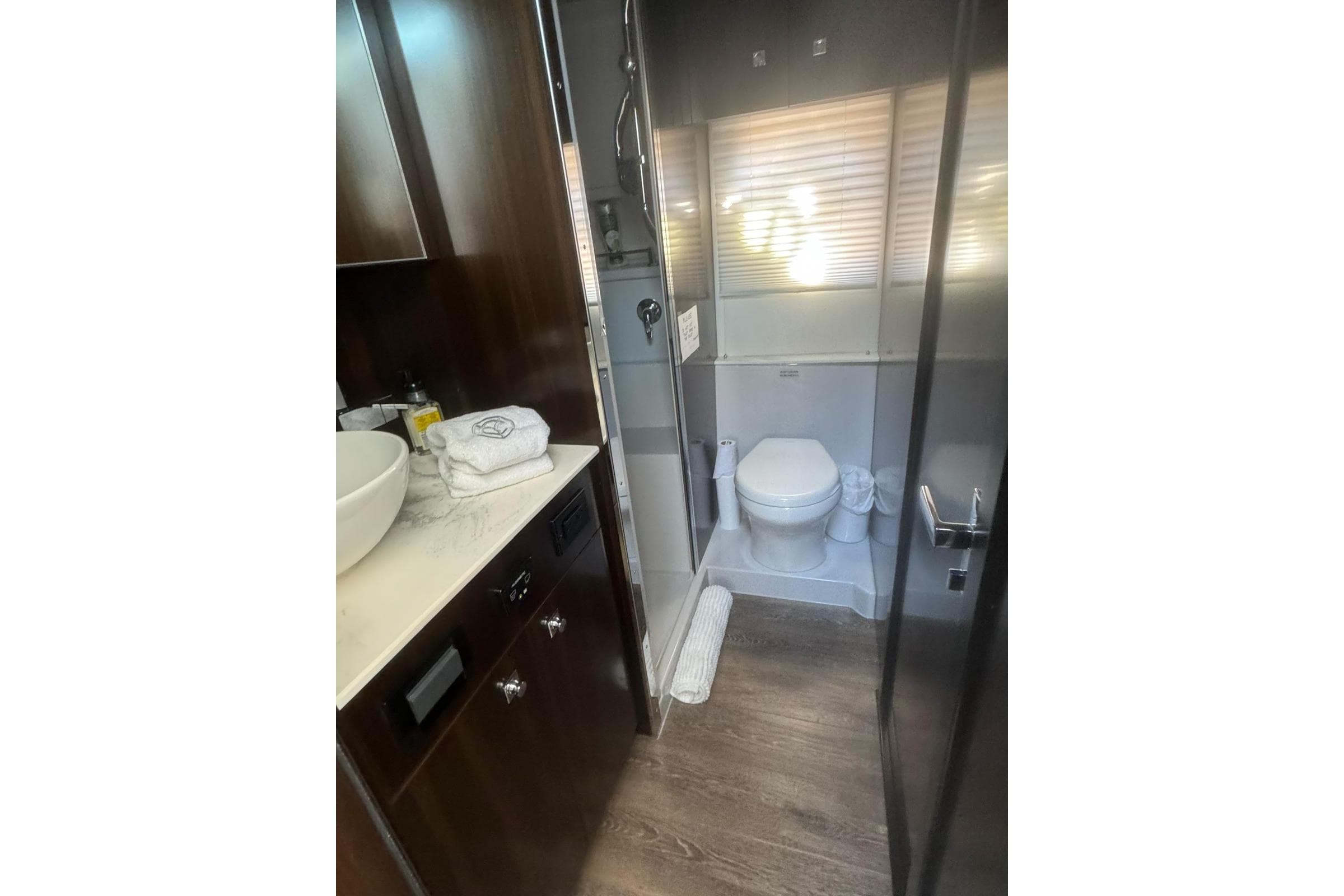 Luxurious bathroom in 2022 Cruisers Yachts 42 Cantius with modern fixtures and elegant design.