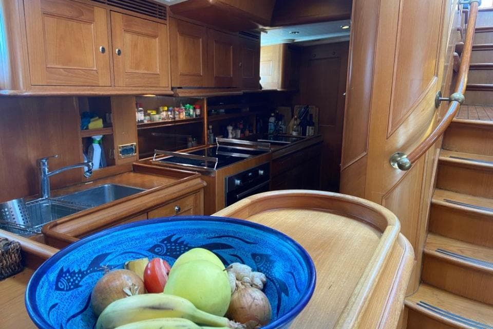 Luxurious wooden yacht kitchen with fruit bowl, Holland Jachtbouw Classic Hoek 82, 2002.