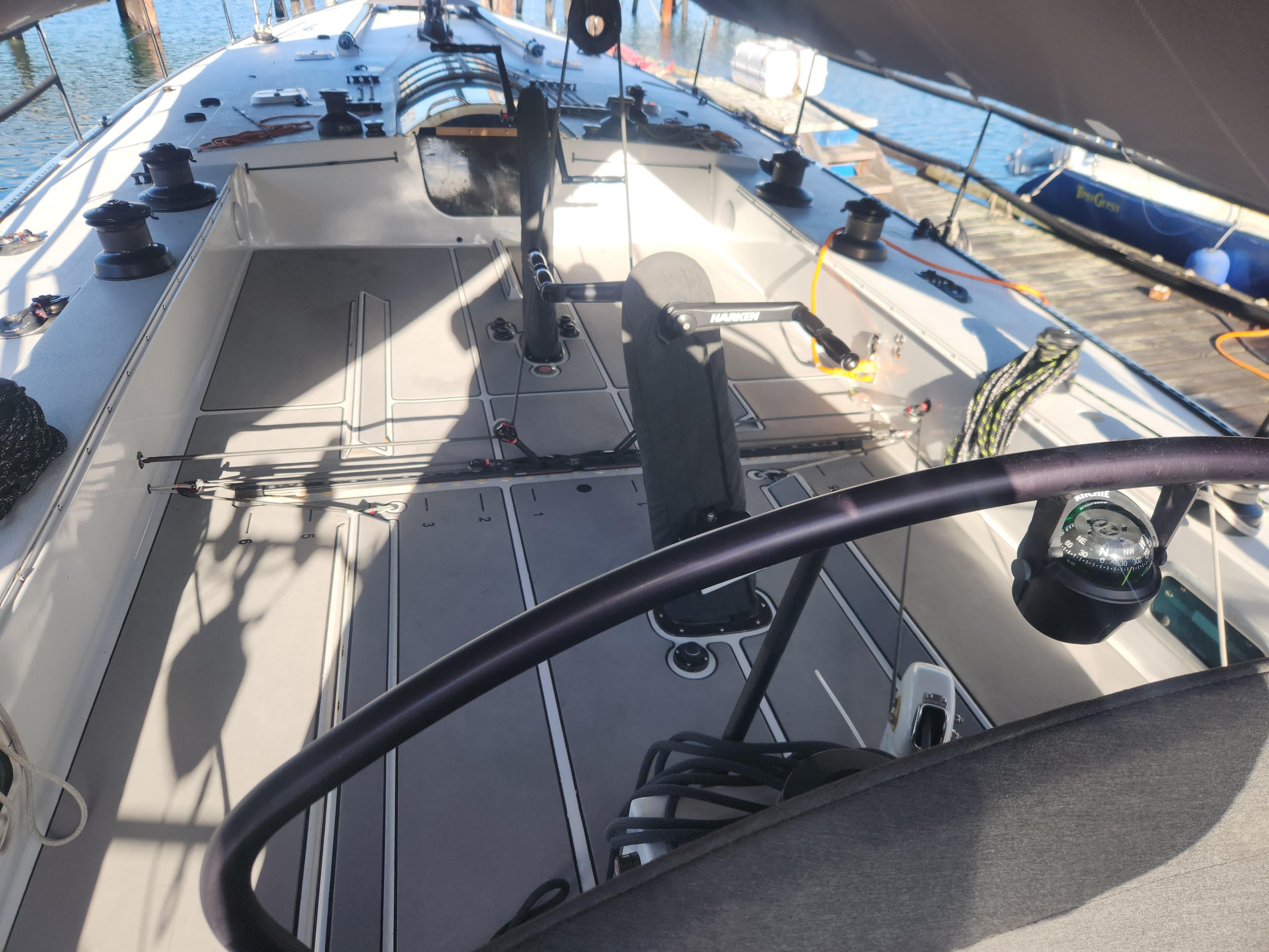 Cockpit of a 1987 Santa Cruz 70 sailboat, featuring sleek design and modern equipment.