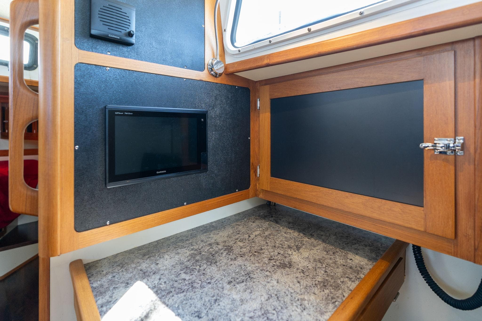 1978 Cascade High Side interior with wood paneling and navigation equipment.