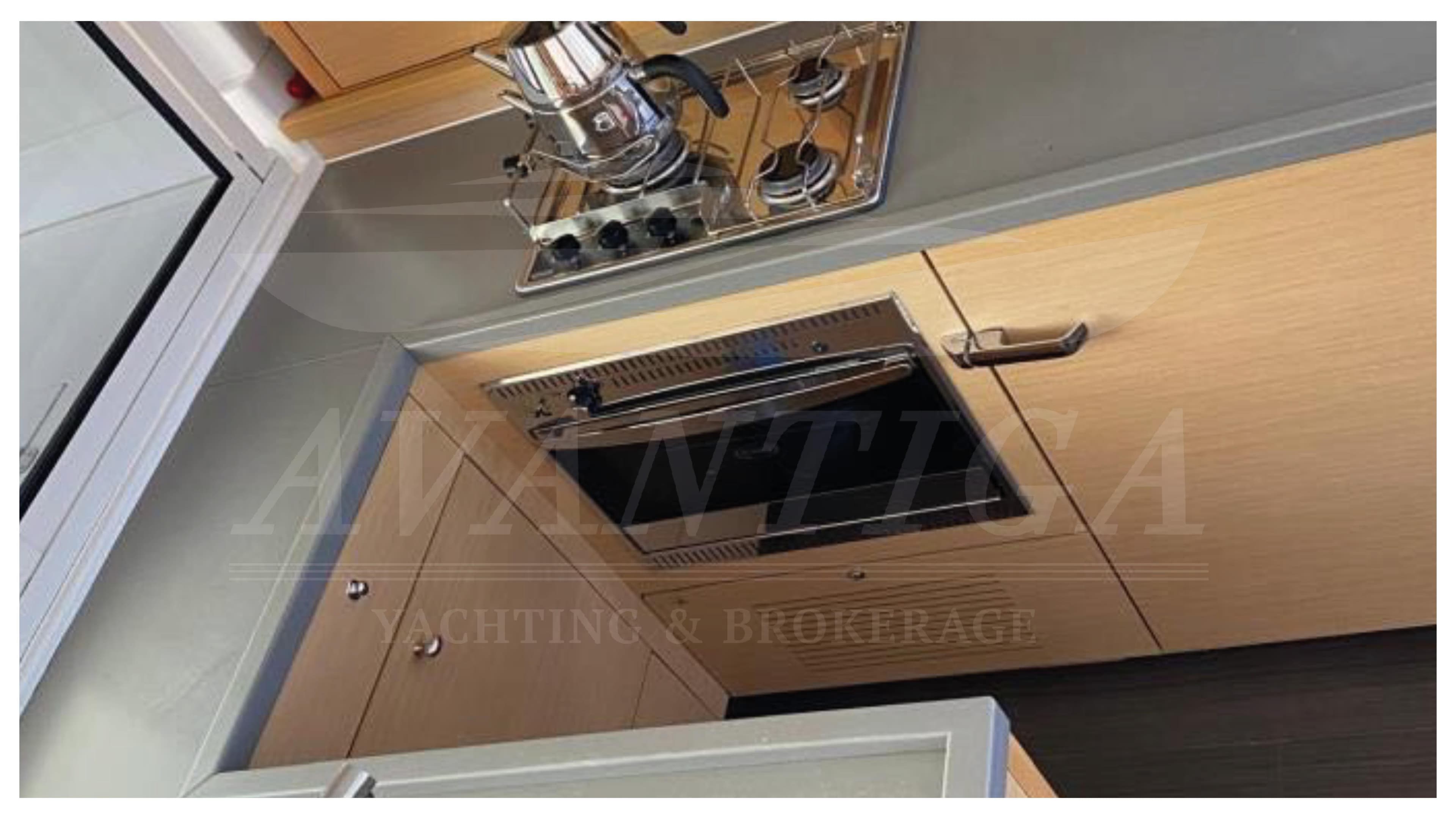 Modern kitchen in 2015 Lagoon 450 F yacht with stove and oven.