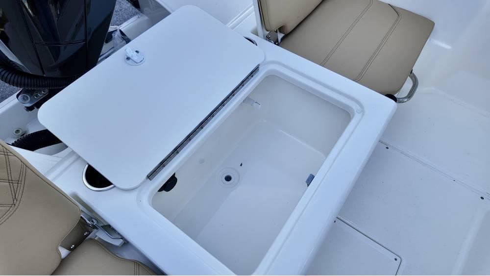 2025 Bayliner Trophy 22 CC boat interior with open storage compartment.
