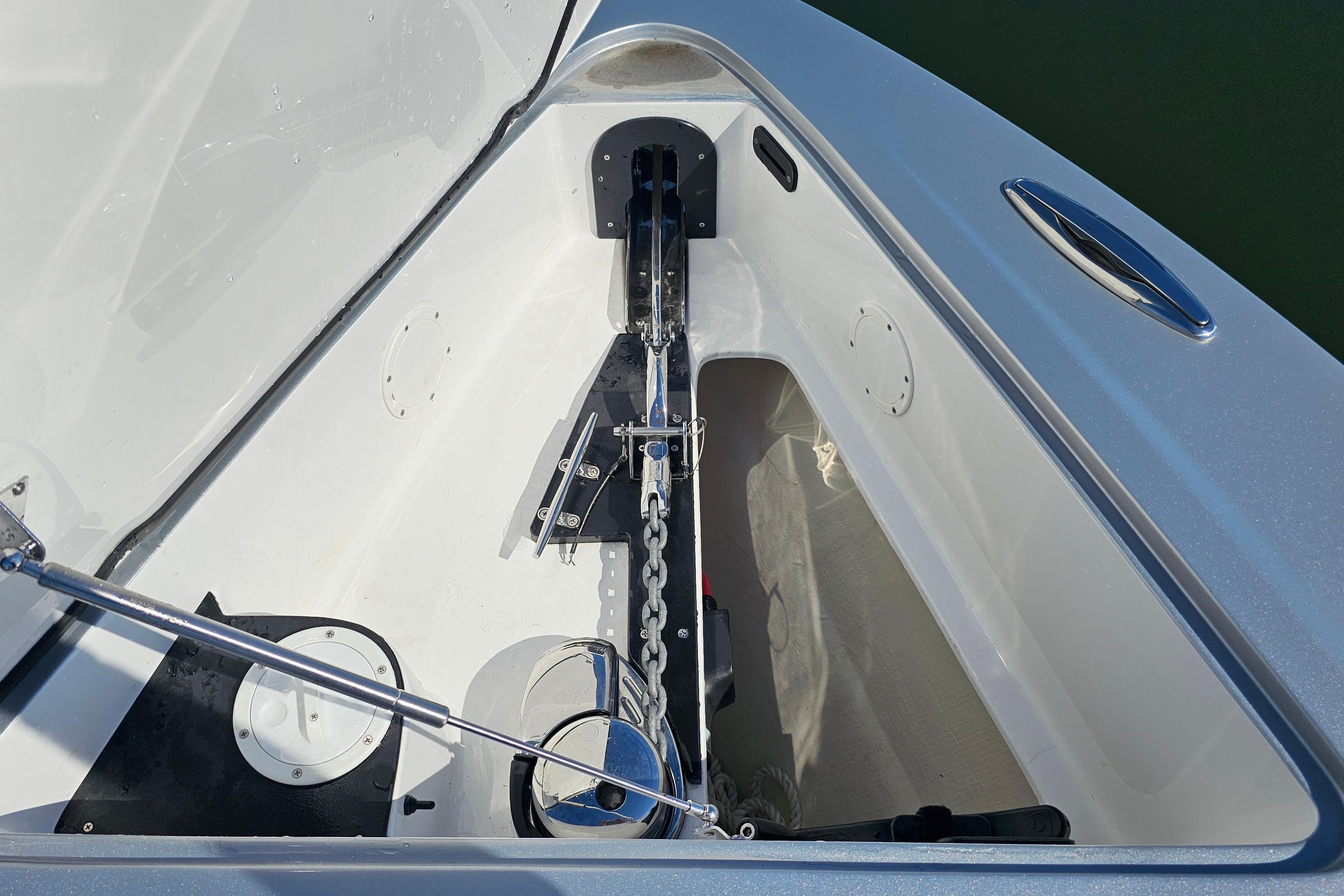 2025 Nor-Tech 390 Sport Center Console anchor compartment with chain and winch system.