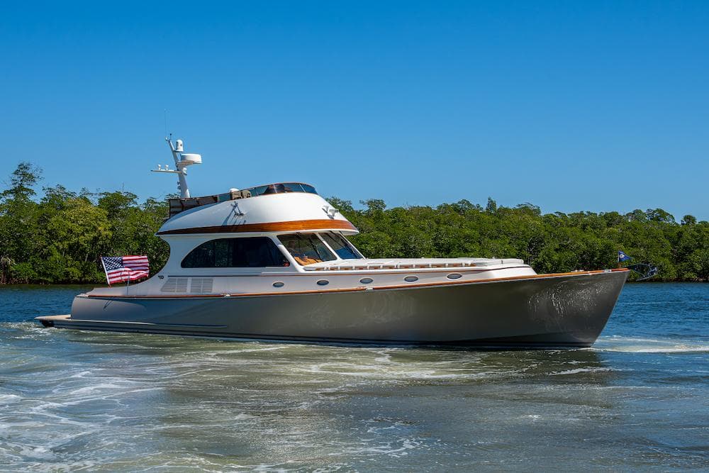 2021 Hinckley Talaria 55 Flybridge MKII yacht cruising on a sunny day.