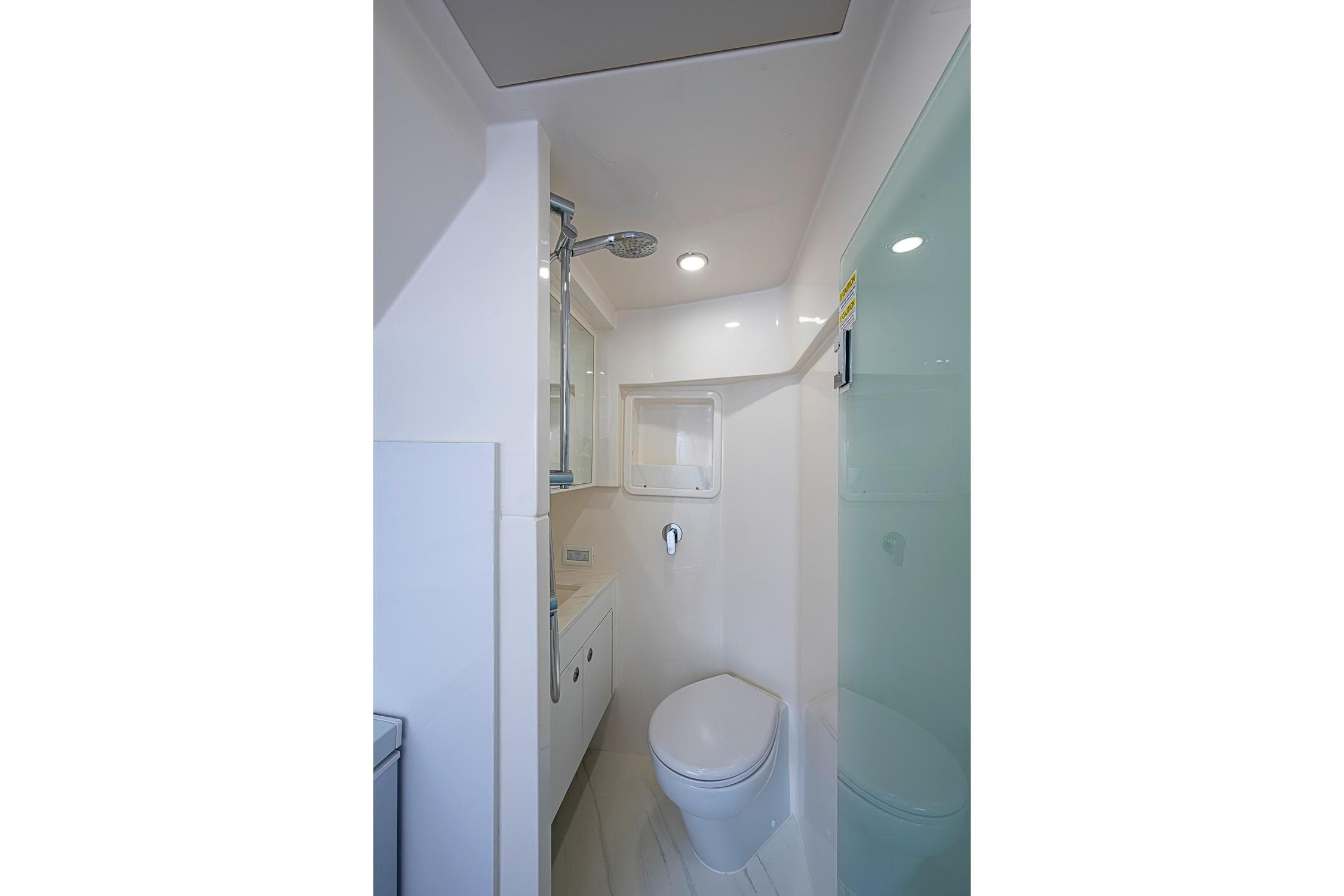 Modern bathroom interior of 2025 Maritimo M75 yacht, featuring sleek design and compact fixtures.