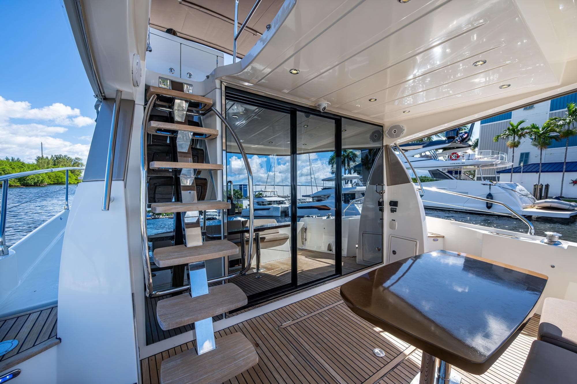 Luxurious 2012 Prestige Flybridge yacht interior with modern staircase and sleek design.