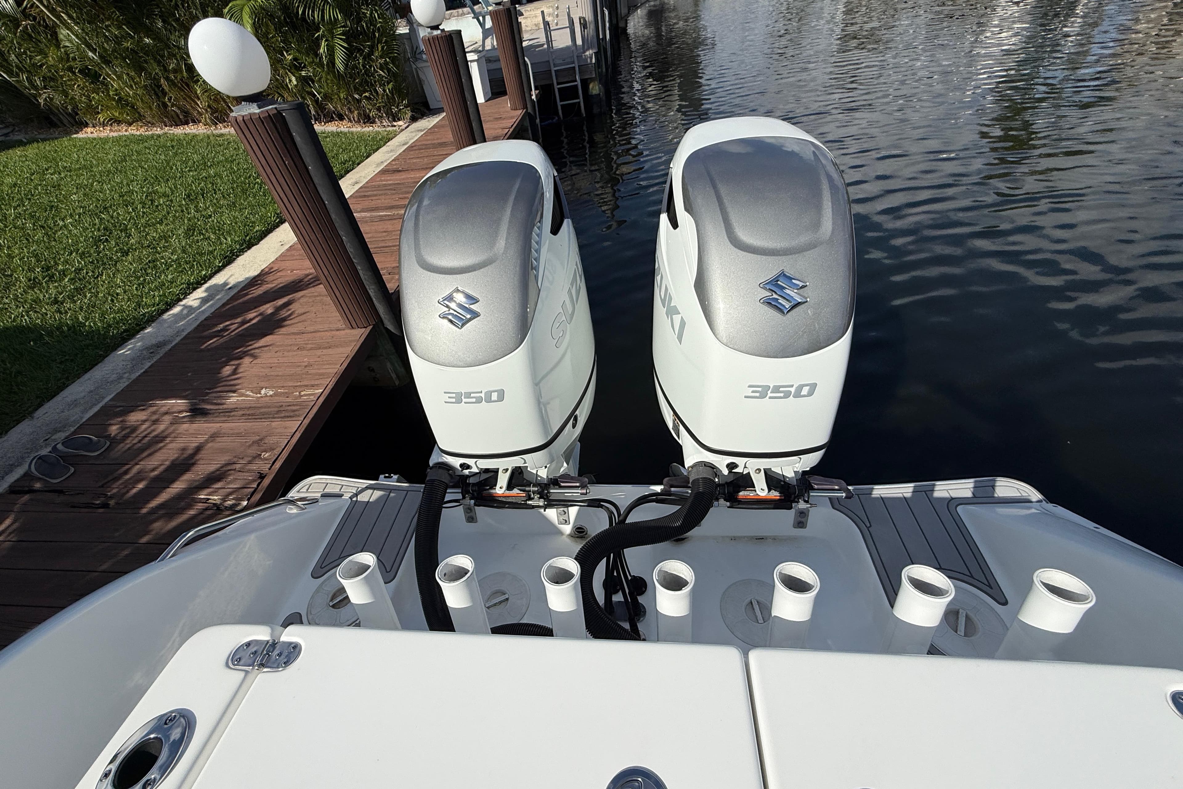 2023 Cape Horn 32 XS boat with dual Suzuki 350 outboard engines at dock.