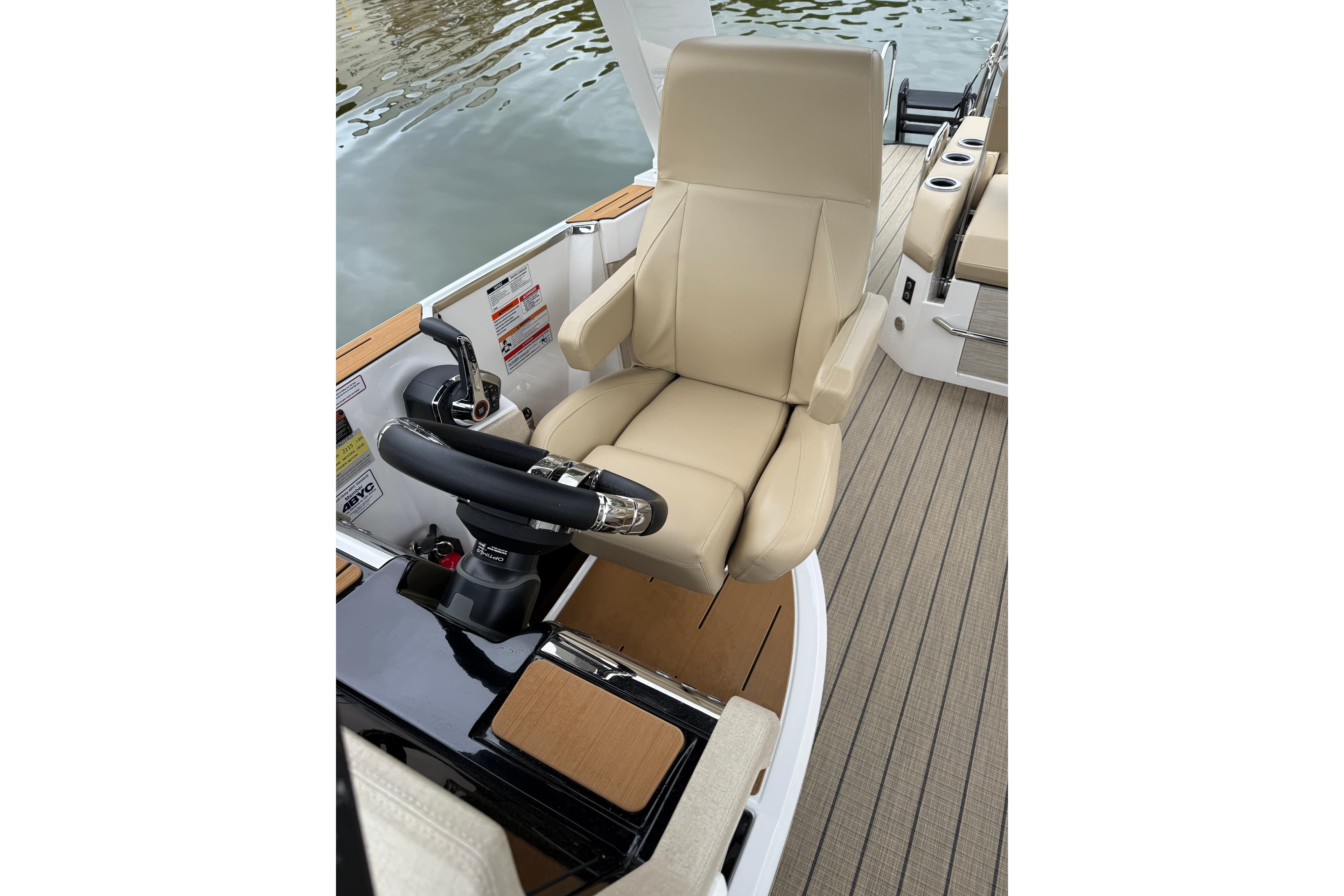 Captain's seat on 2025 Balise Helix 26 L boat, featuring sleek design and modern controls.