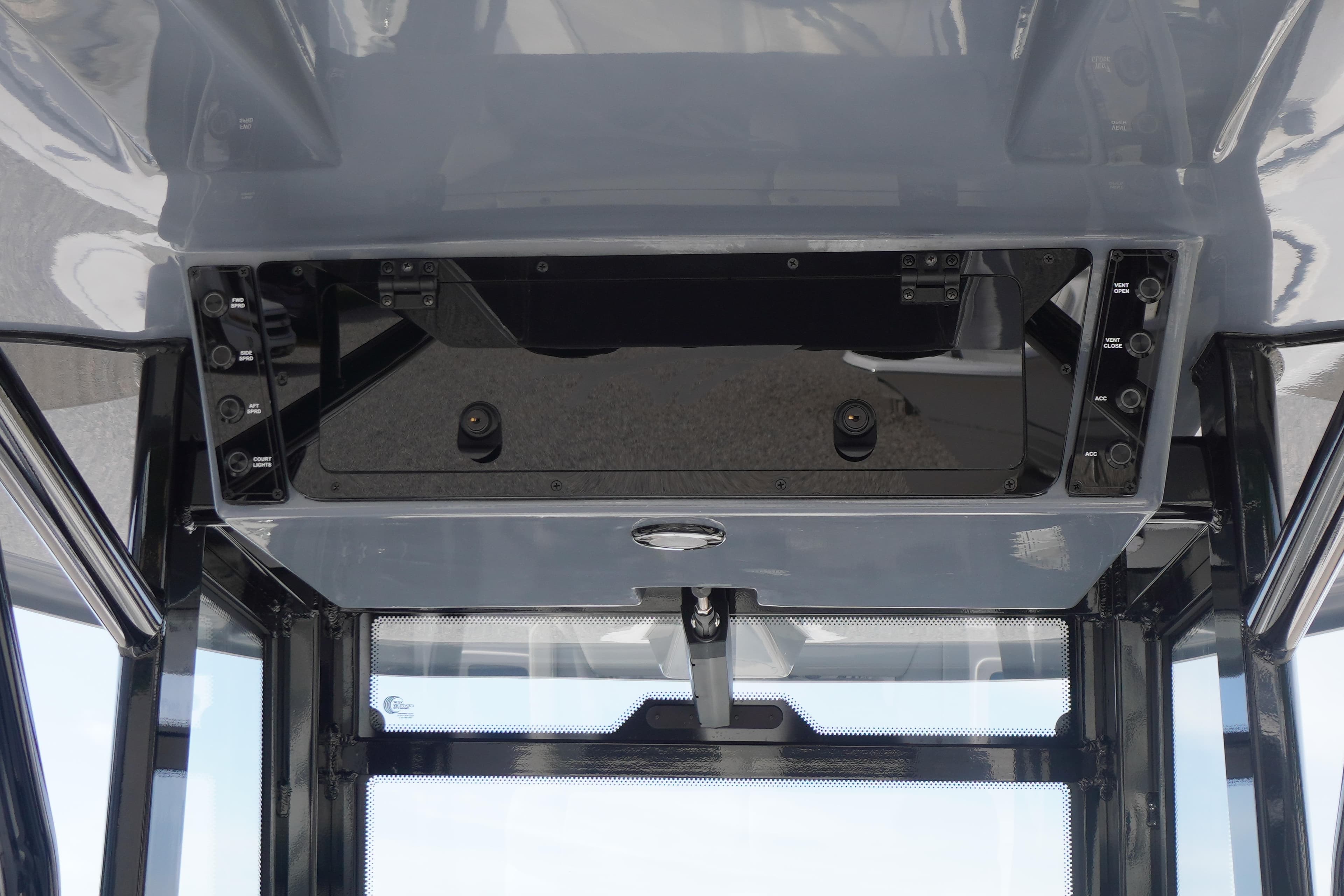 Overhead console of 2026 Tidewater 282 CC Adventure boat, featuring control switches and sleek design.