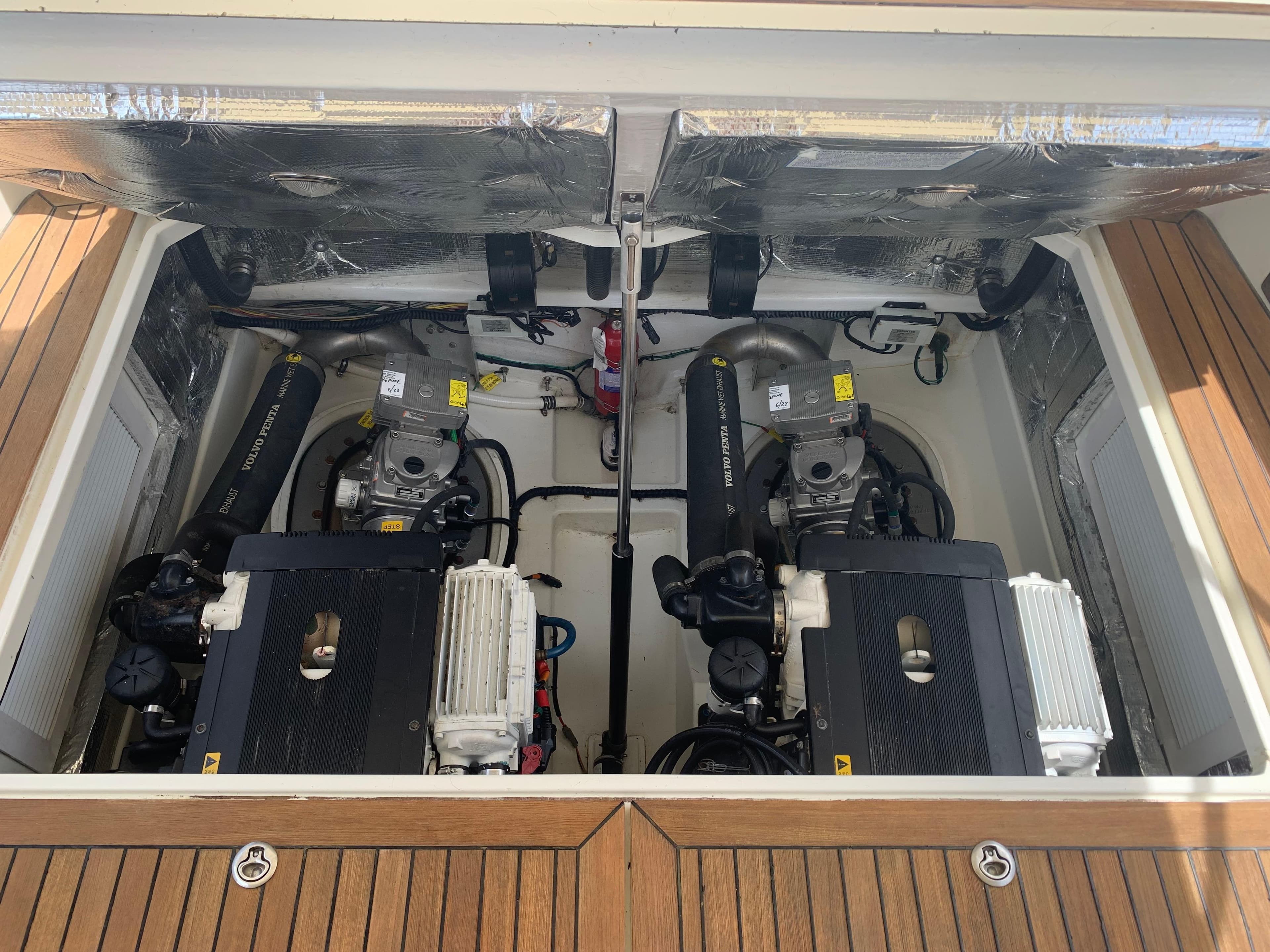 Engine compartment of a 2011 MJM 40z Downeast boat with twin engines.