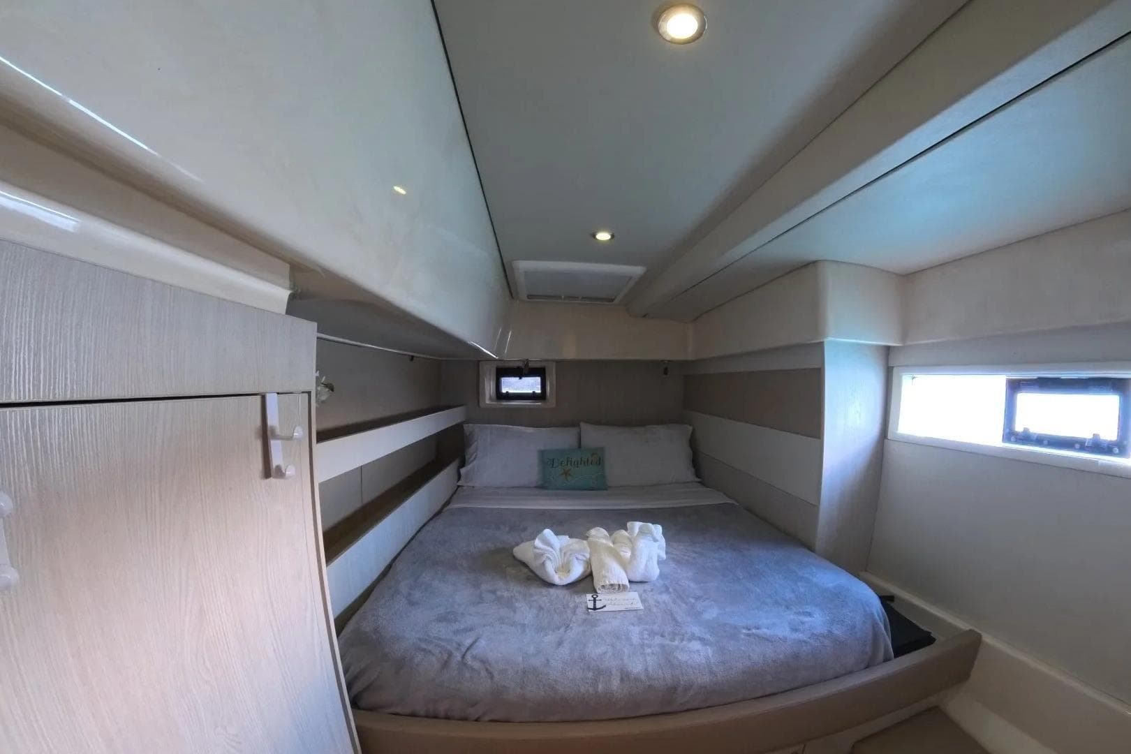 Luxurious cabin interior of 2014 Leopard 51 Powercat with cozy bed and modern design.