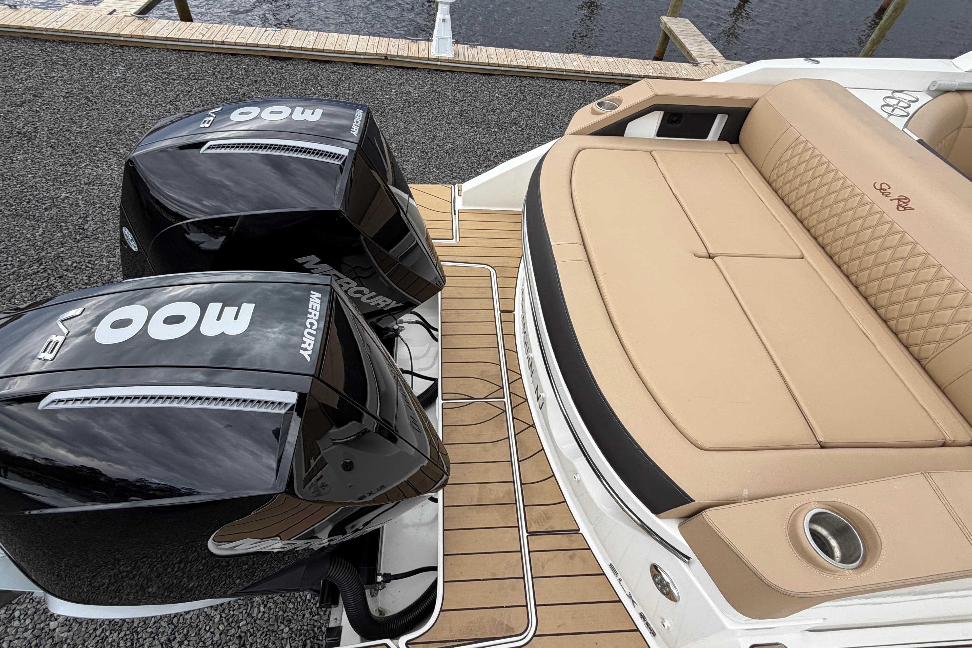 2023 Sea Ray SLX 310 Outboard with twin Mercury 300 engines and luxurious tan seating.