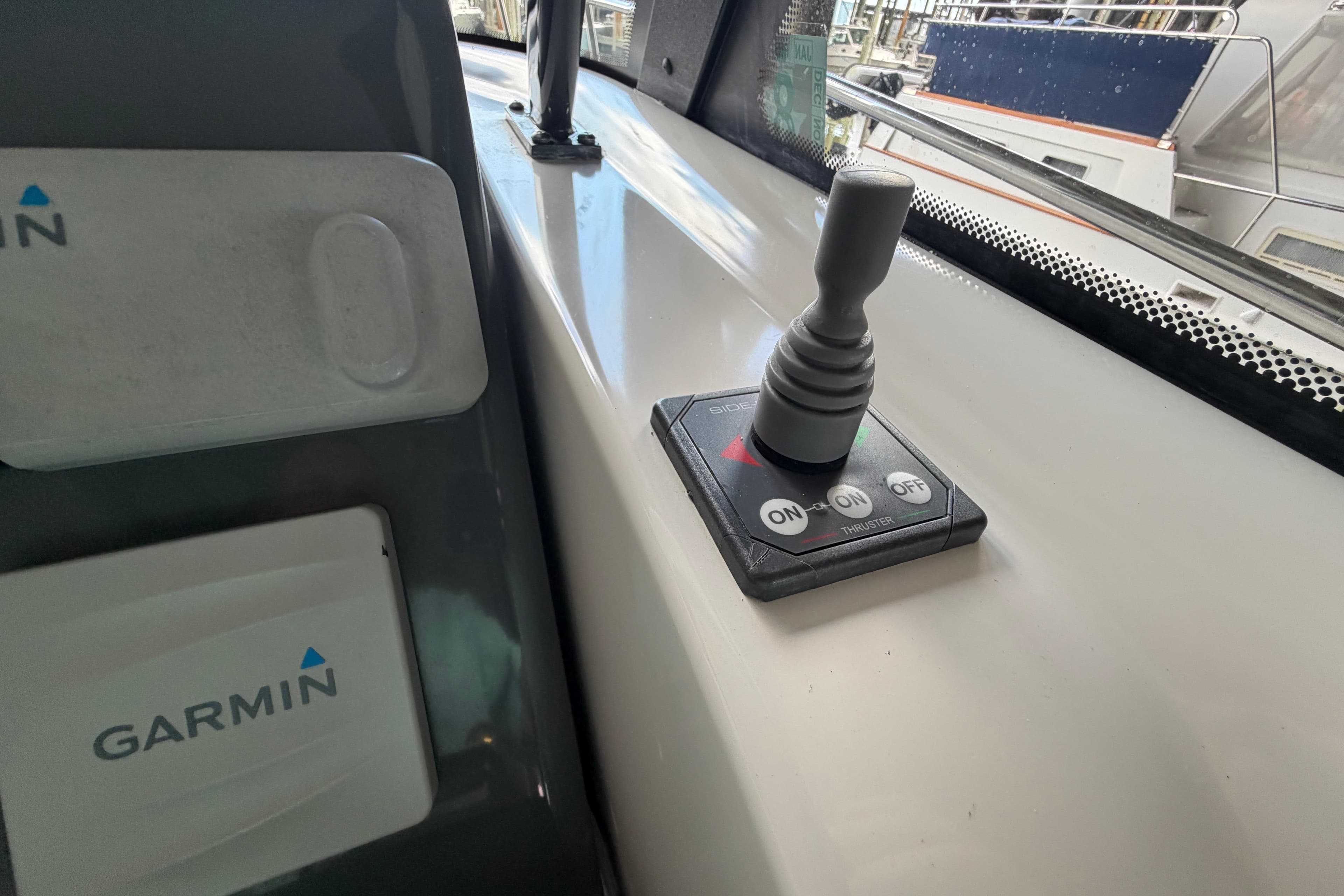 Control panel with joystick and Garmin device on 2002 Tiara Yachts 3800 Open.