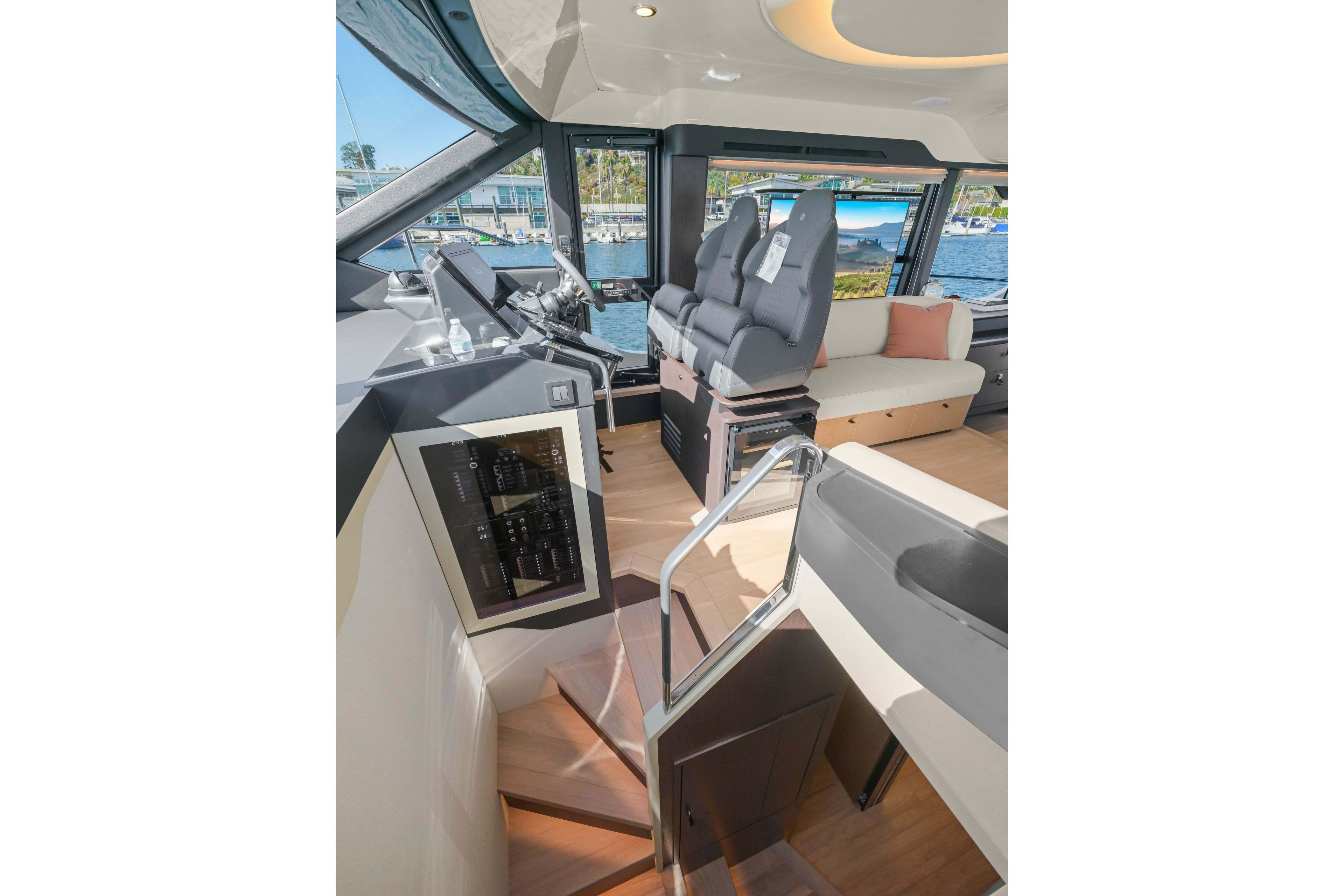 Interior of 2026 Absolute 52 Fly yacht, featuring modern helm and seating area.