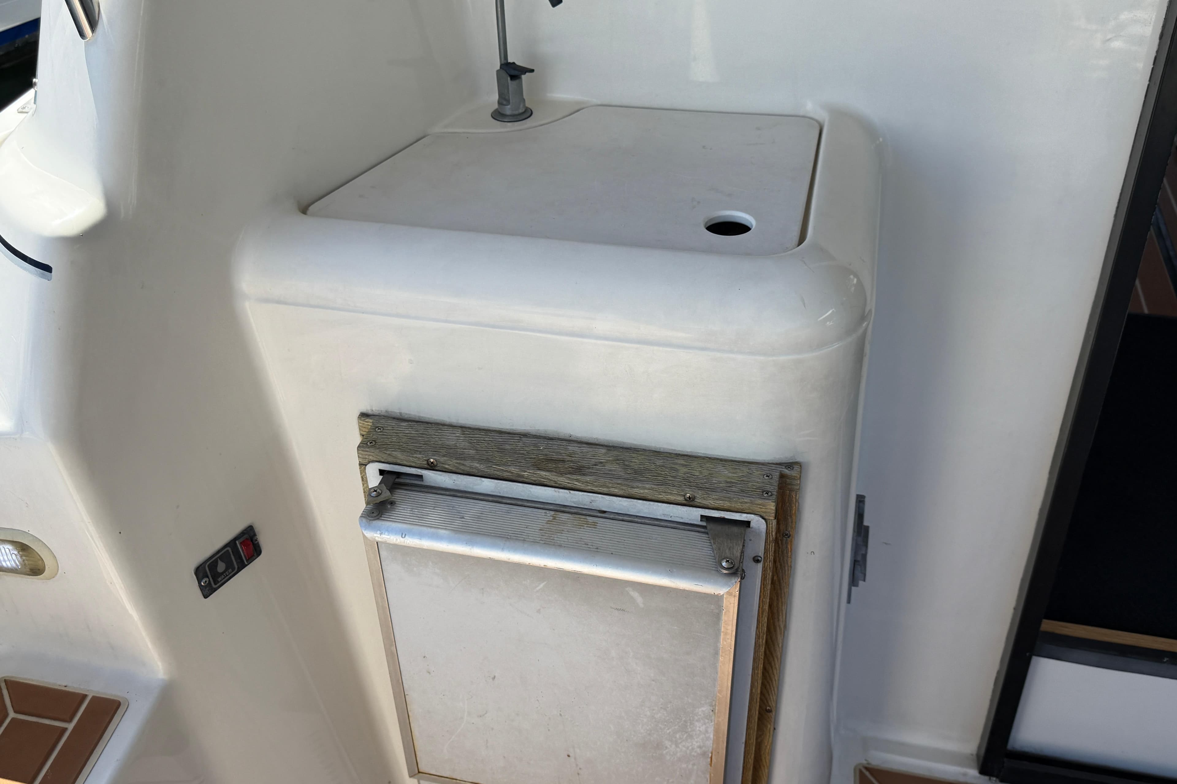 1998 Bayliner 3788 Command Bridge Motoryacht interior detail with built-in storage compartment.