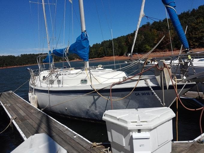 1973 Allied Mistress sailboat docked at marina.