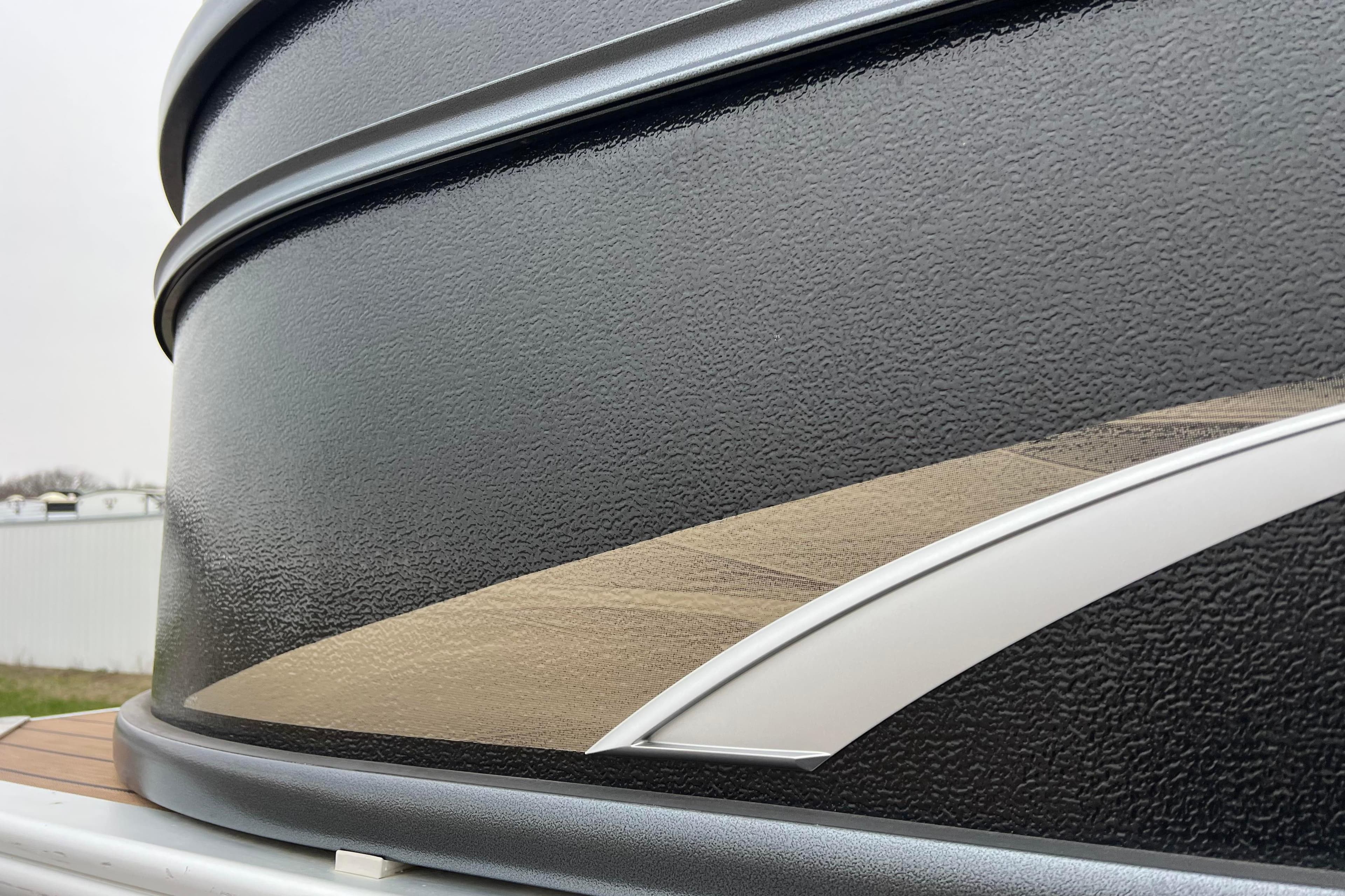 Close-up of 2017 Premier 230 SunSation RF boat exterior with sleek design details.