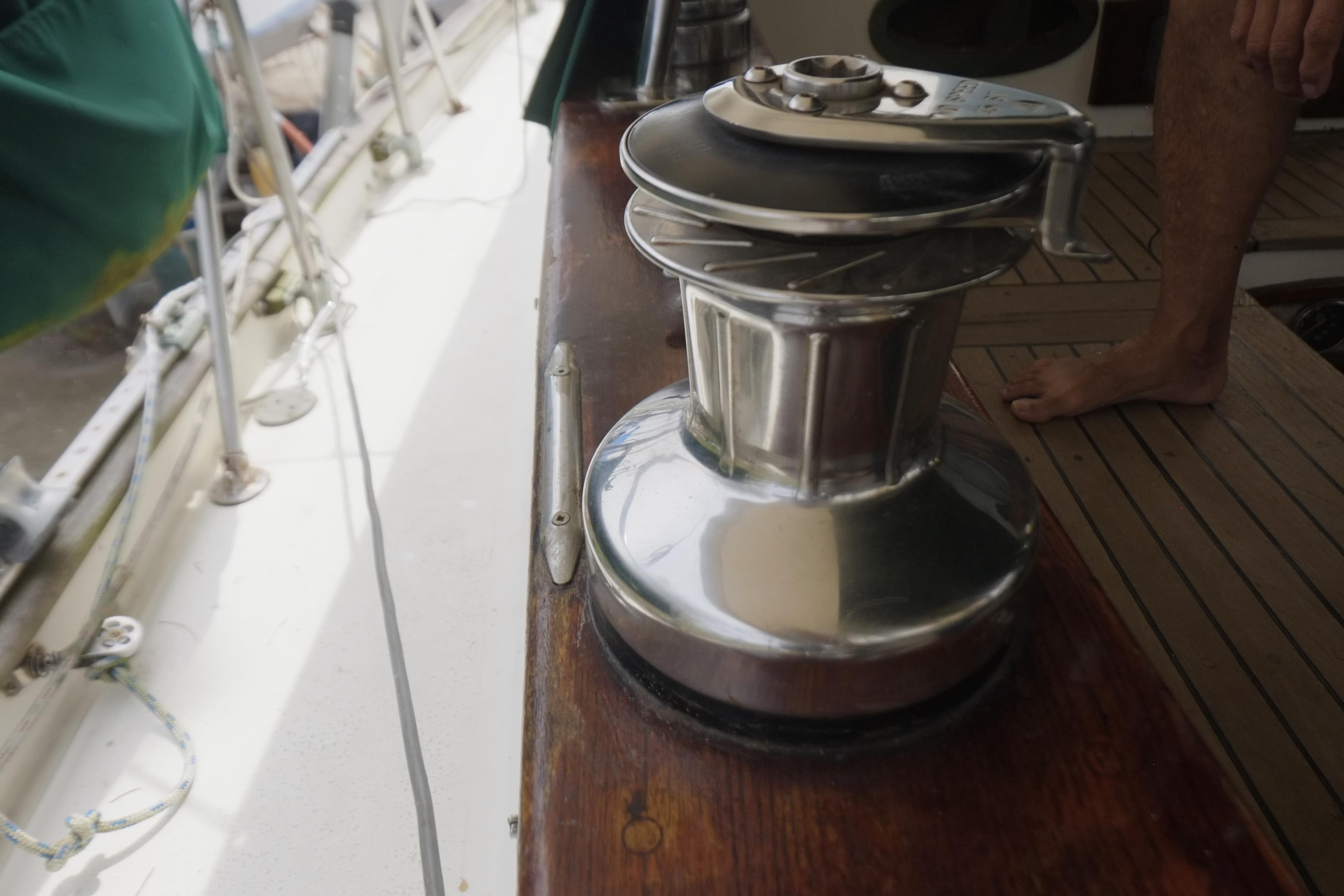 Winch on 1978 Formosa 46 sailboat deck, showcasing nautical equipment.