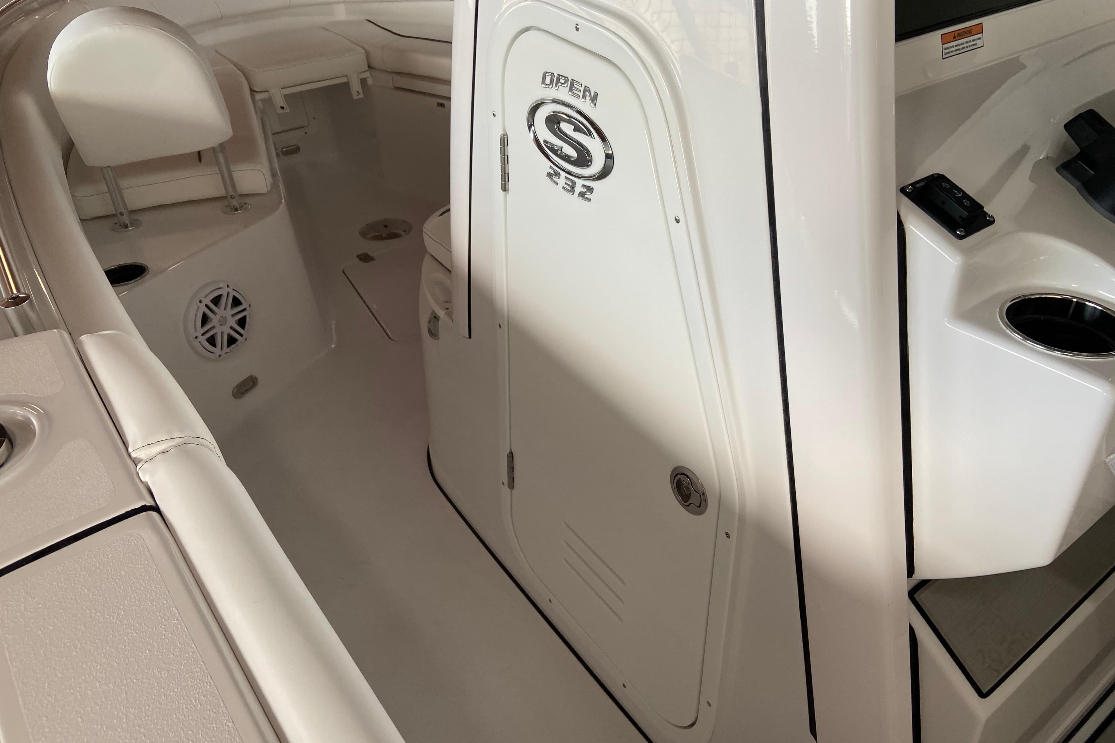 2026 Sportsman Open 232 Center Console interior with seating and storage compartments.