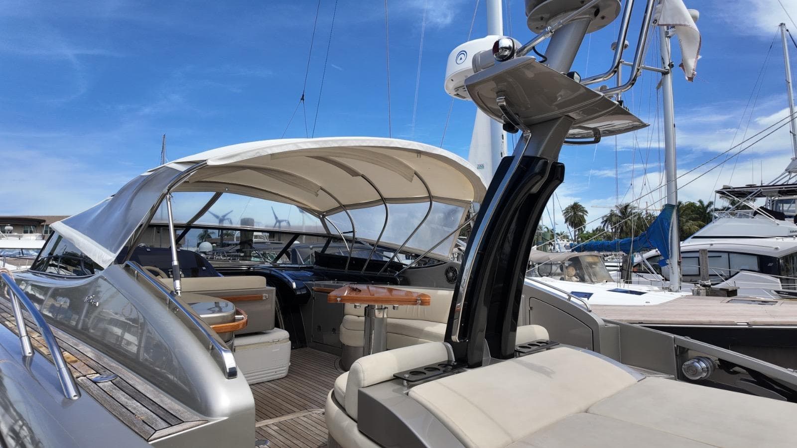 2012 Riva Rivale yacht with sleek design, docked under clear blue sky.