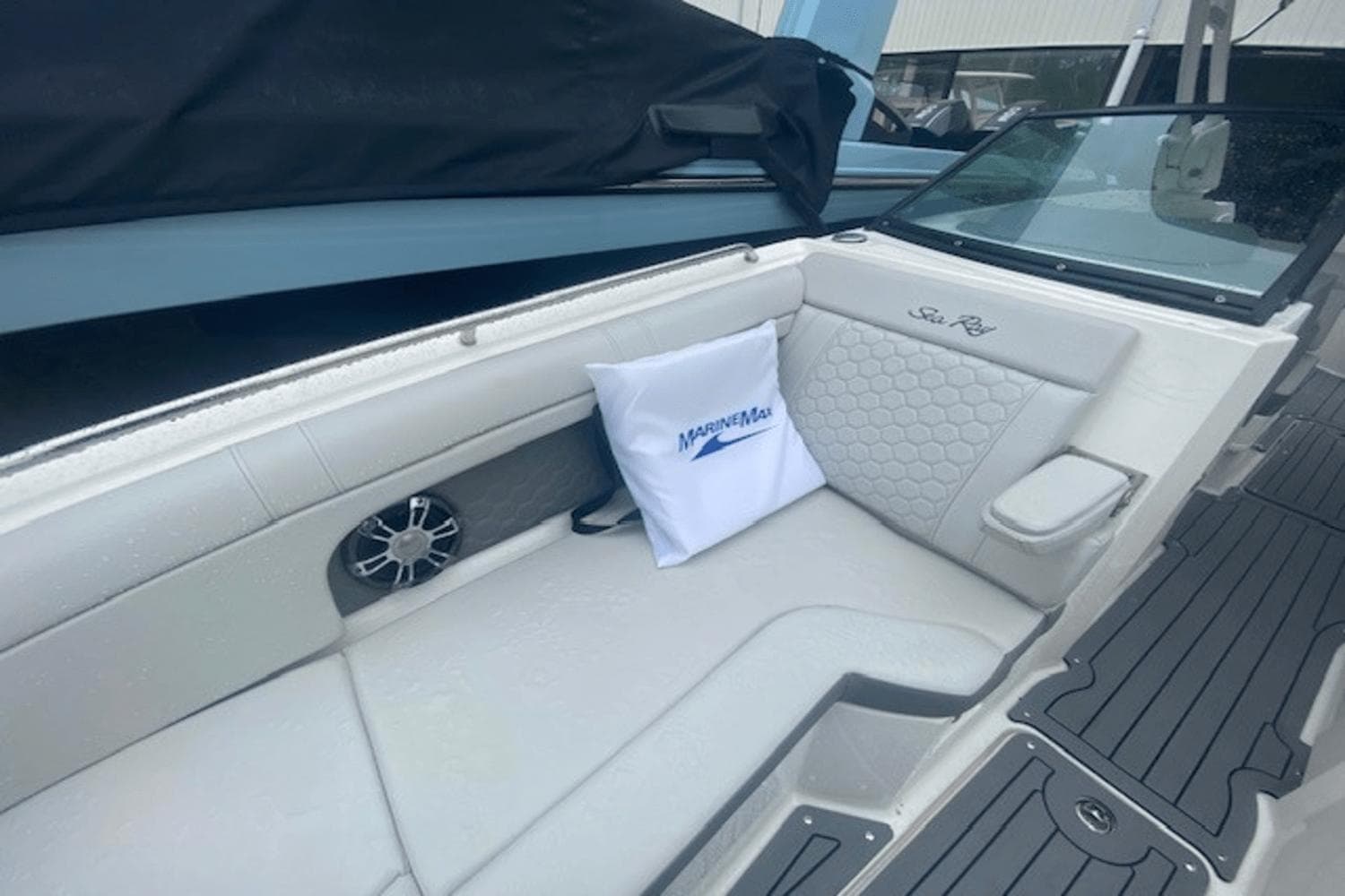 2021 Sea Ray SDX 270 boat interior with cushioned seating and MarineMax pillow.