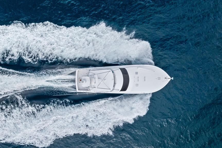 Aerial view of 2005 Viking 61 Convertible yacht cruising on open ocean.