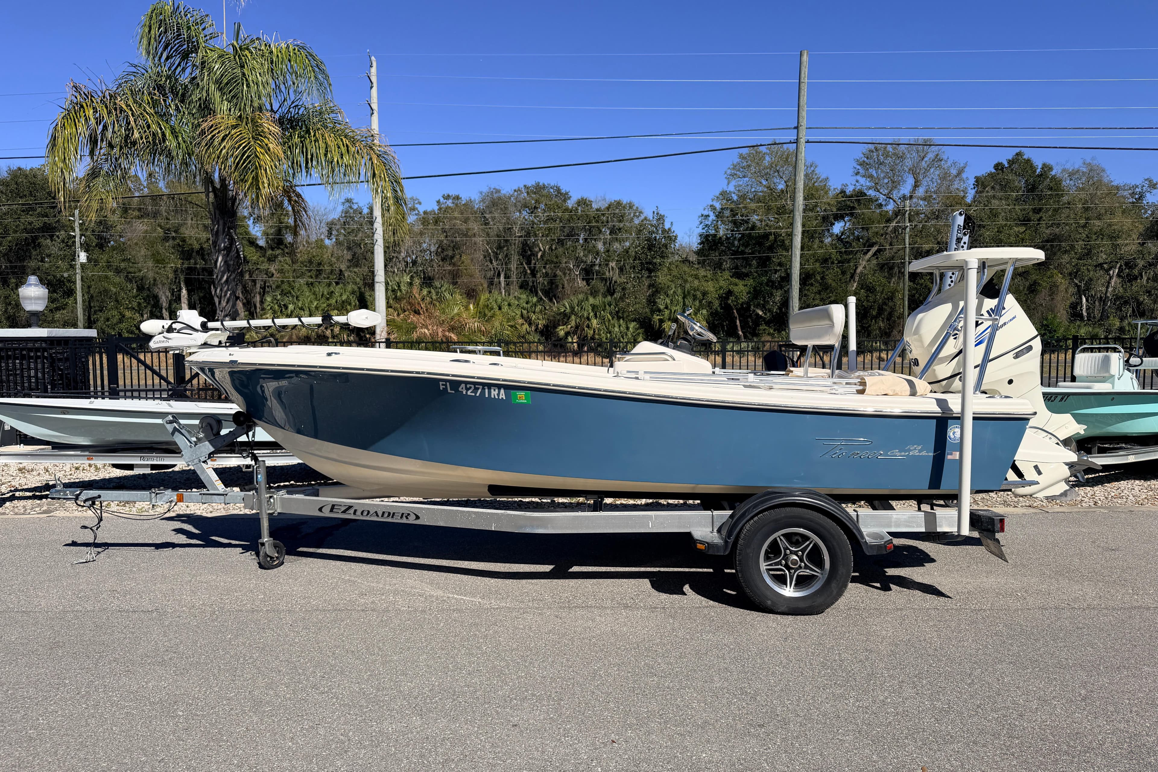 2015 Pioneer 186 Cape Island boat on trailer, parked outdoors.