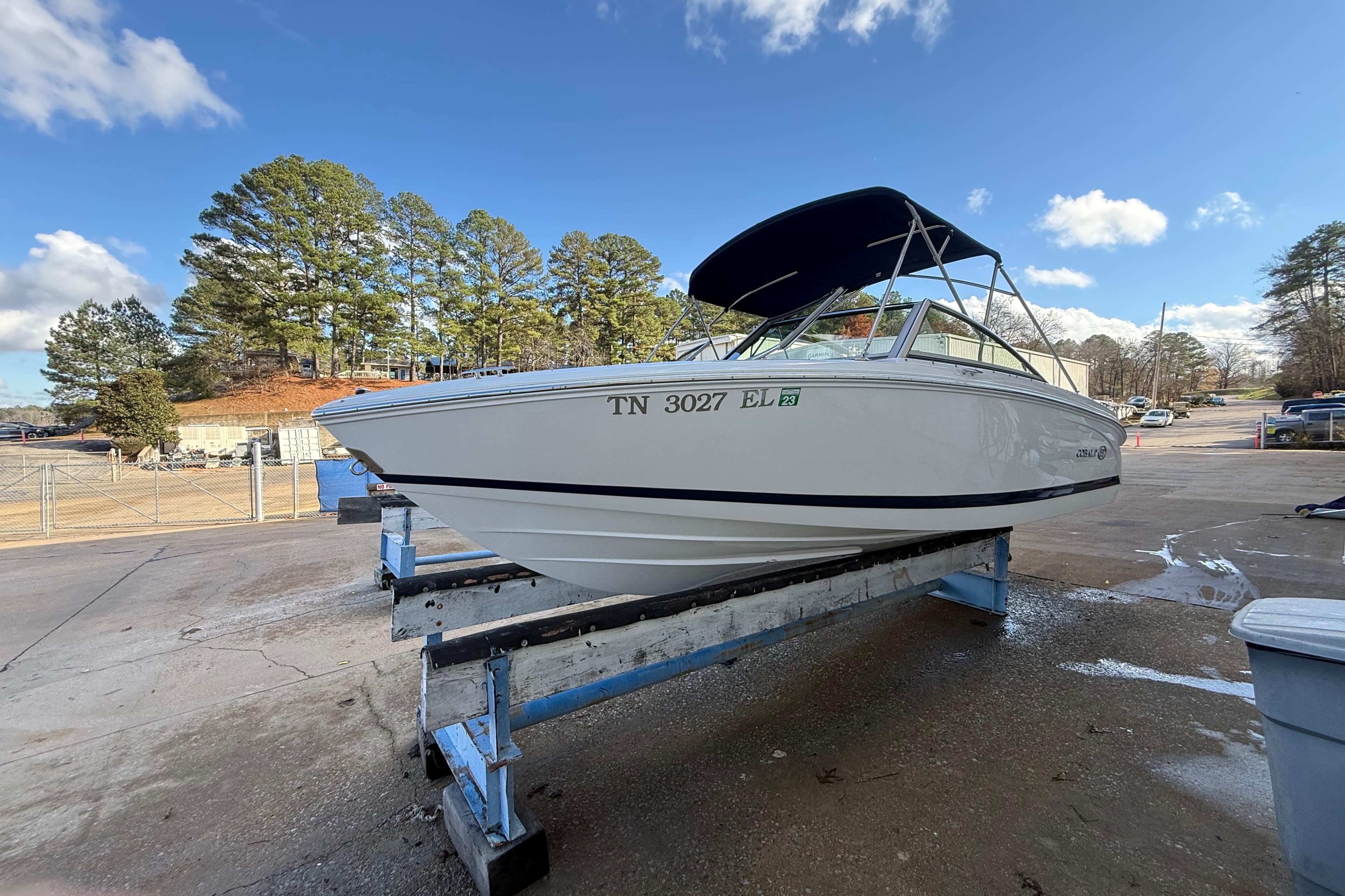 2015 Cobalt 200 boat on trailer, parked outdoors under a clear blue sky.