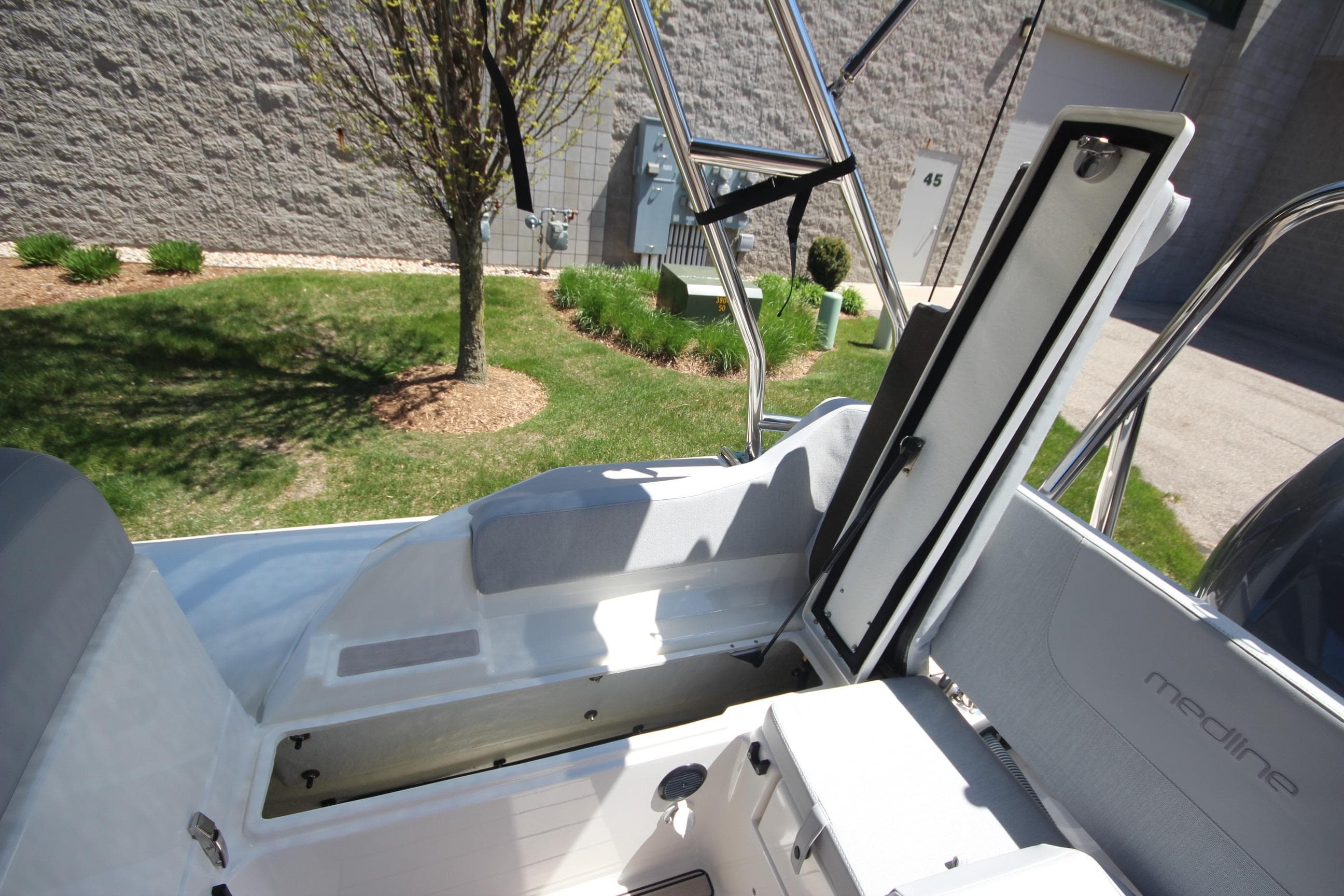2025 Zodiac Medline 6.8 NEO boat interior with open storage compartment.