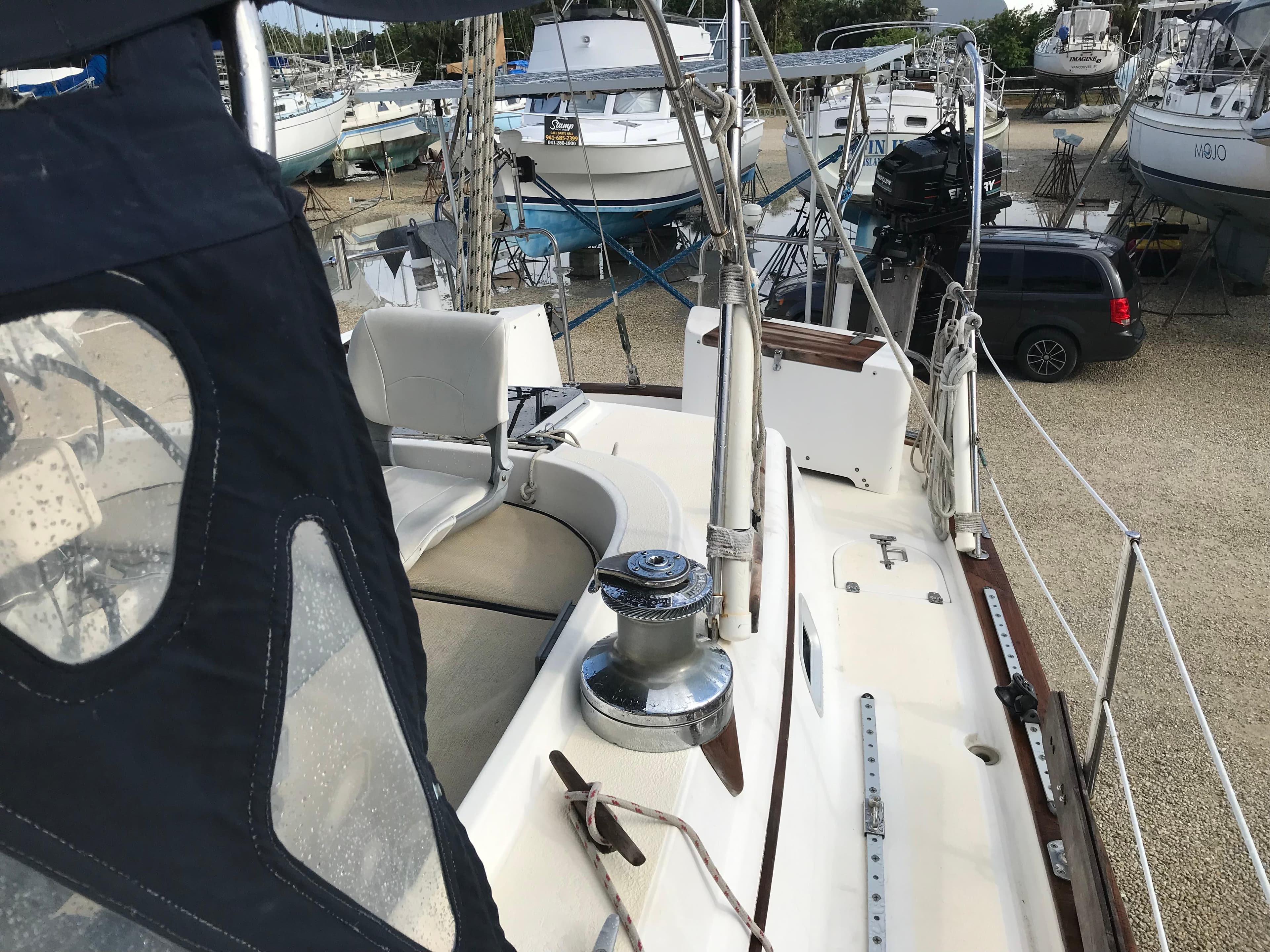 1990 Endeavour 38 CC sailboat deck view in a marina setting.