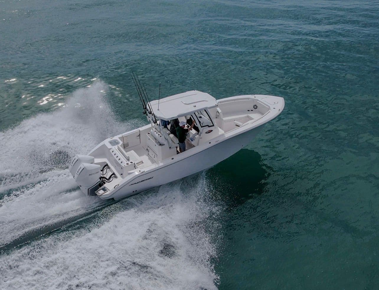 Aquasport 28AS 2025 boat cruising swiftly on open sea.