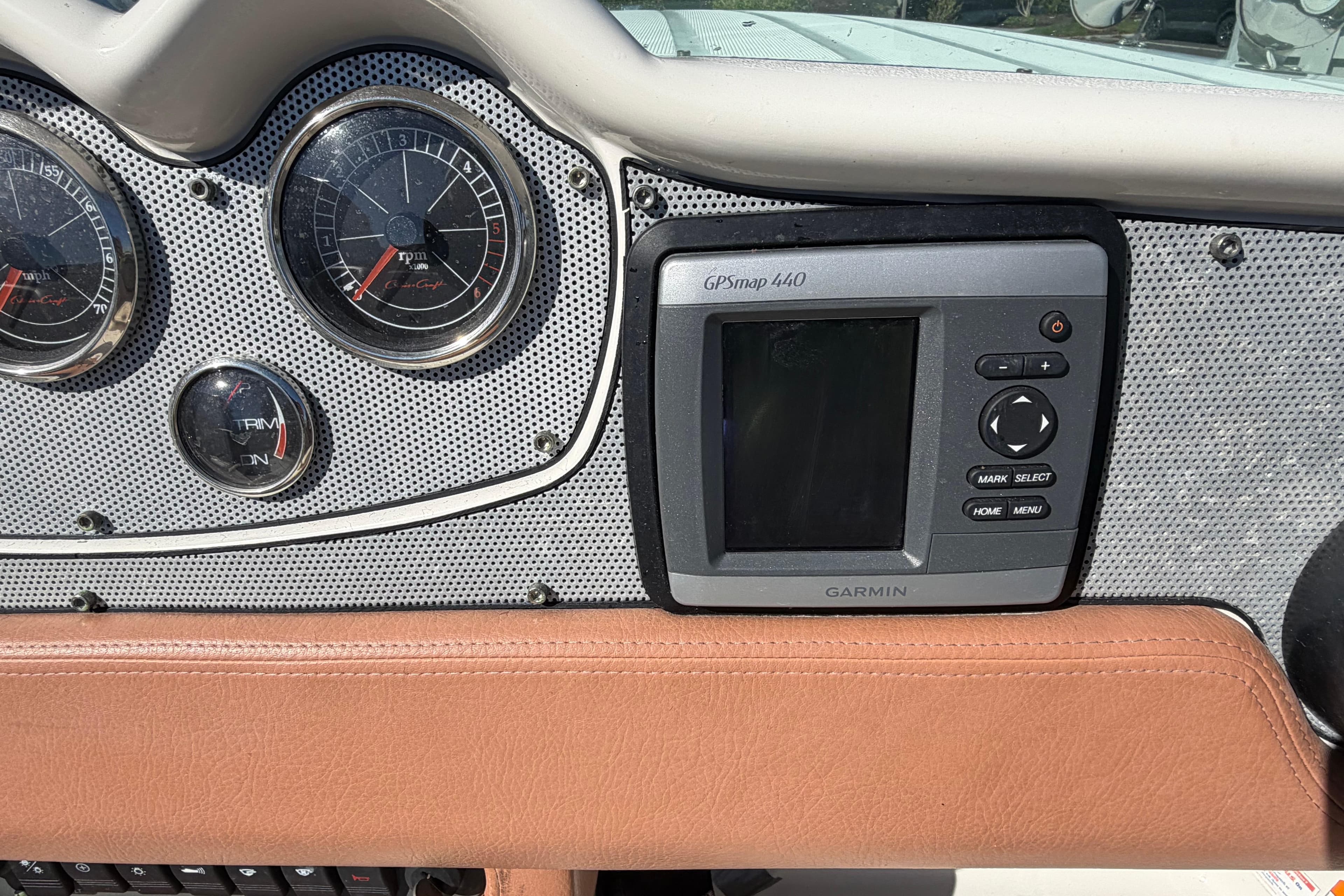 Dashboard of a 2006 Chris-Craft Speedster with Garmin GPSmap 440 and gauges.