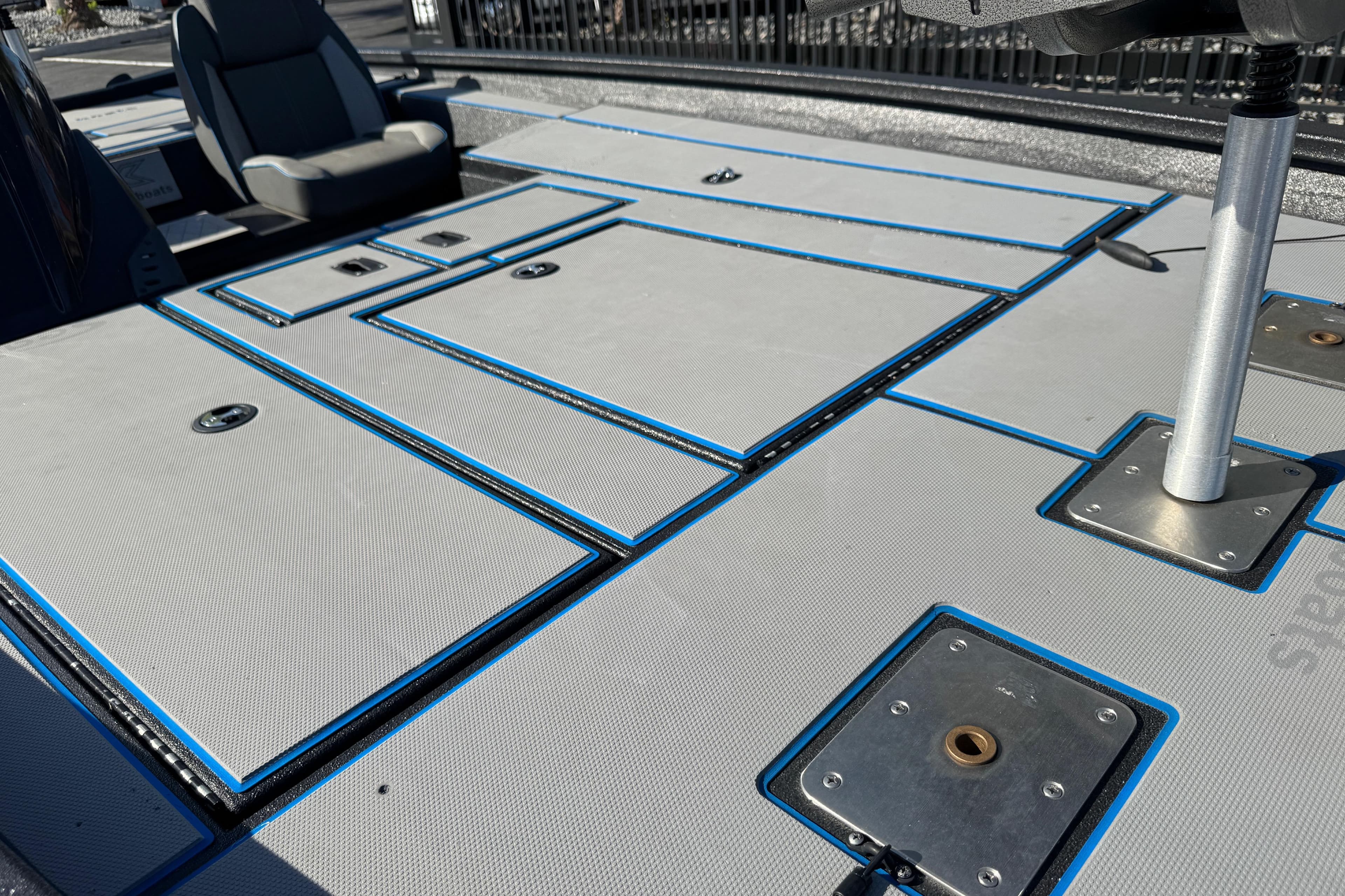 2025 Express H20 boat deck with storage compartments and seating.