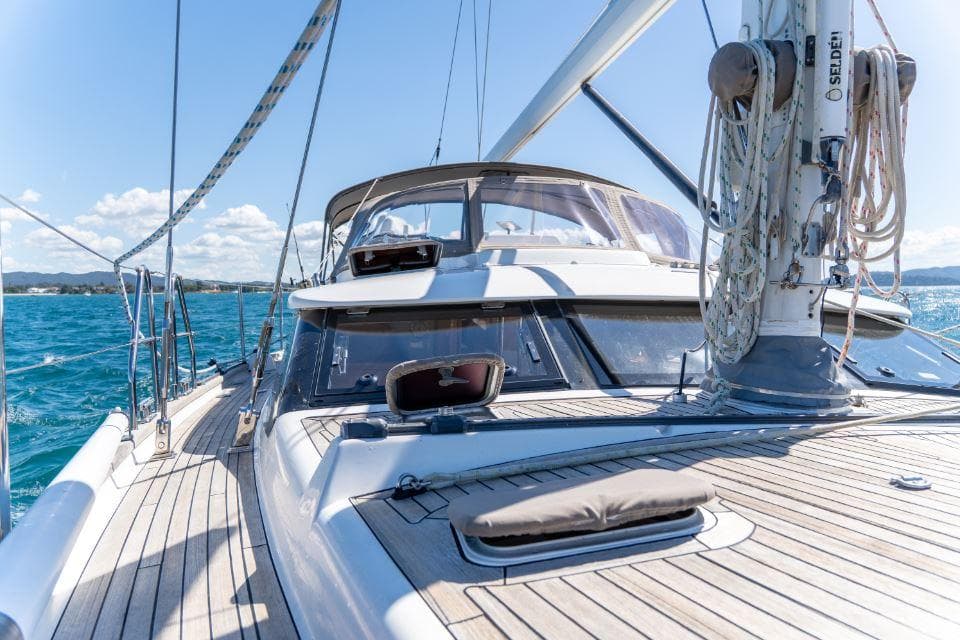 Sailing yacht Discovery 55, 2008 model, cruising on clear blue waters.
